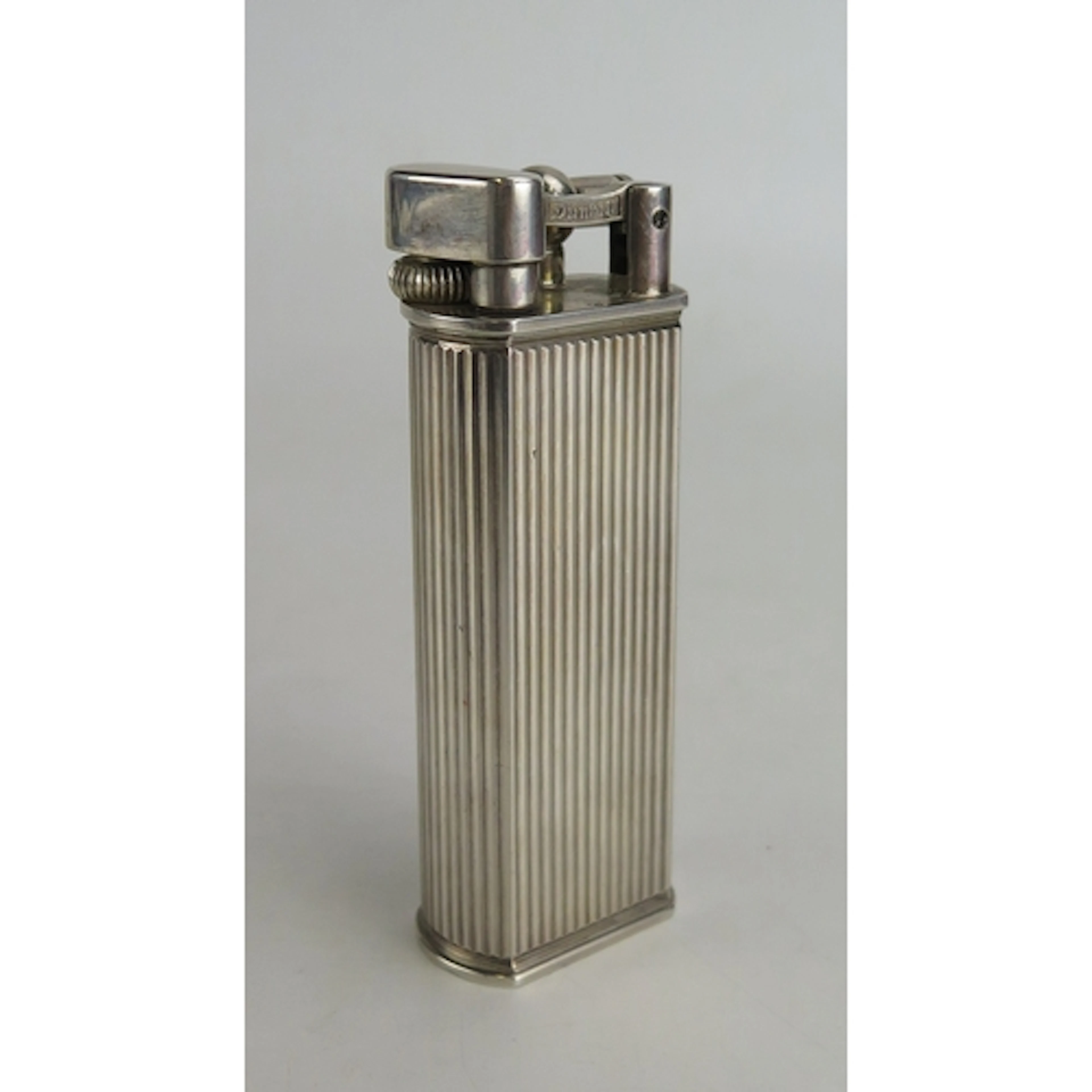 Dunhill, Paris, a silver table lighter, stamped marks, with...