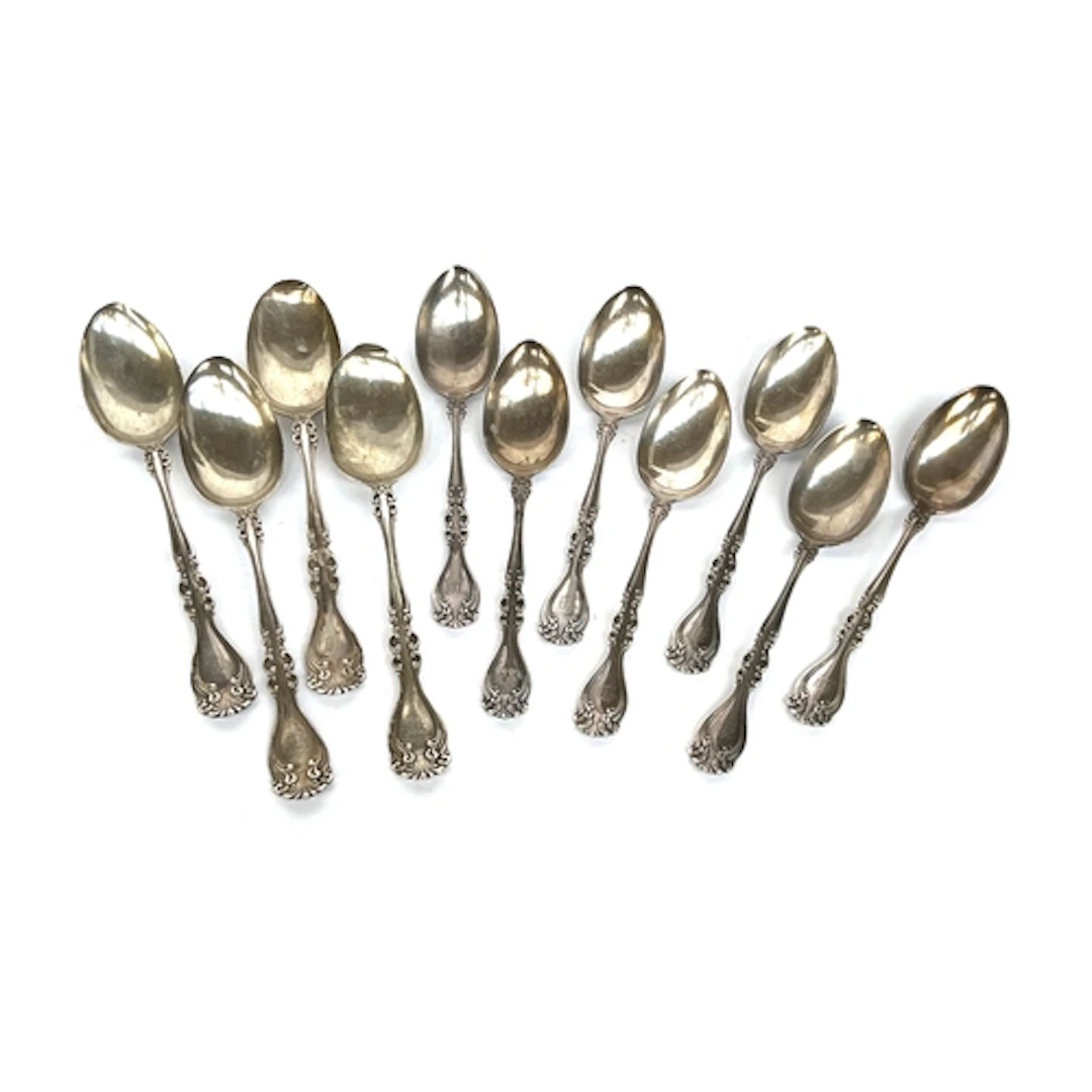 11 sterling silver spoons, comprising four tablespoons and s...