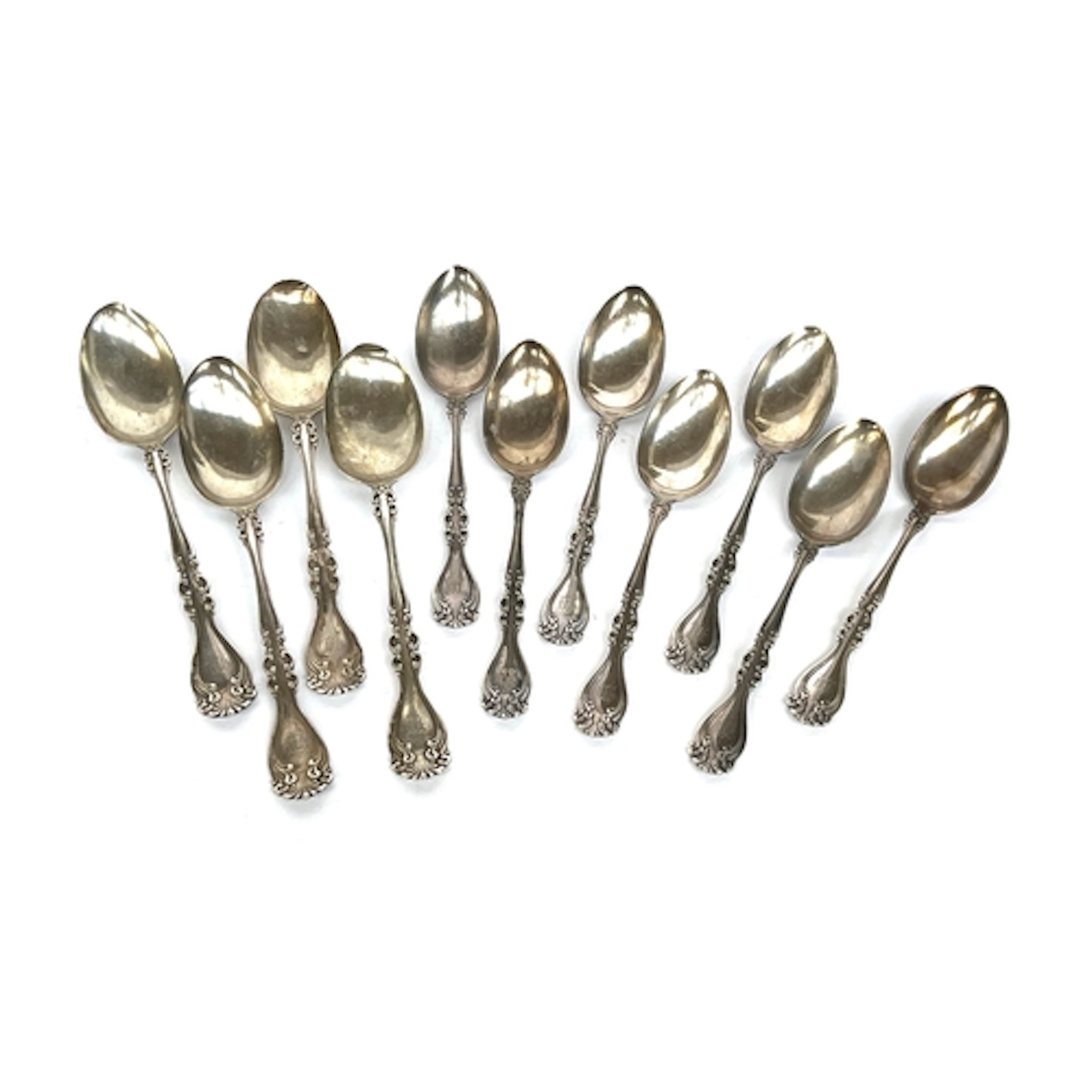 11 sterling silver spoons, comprising four tablespoons and s...