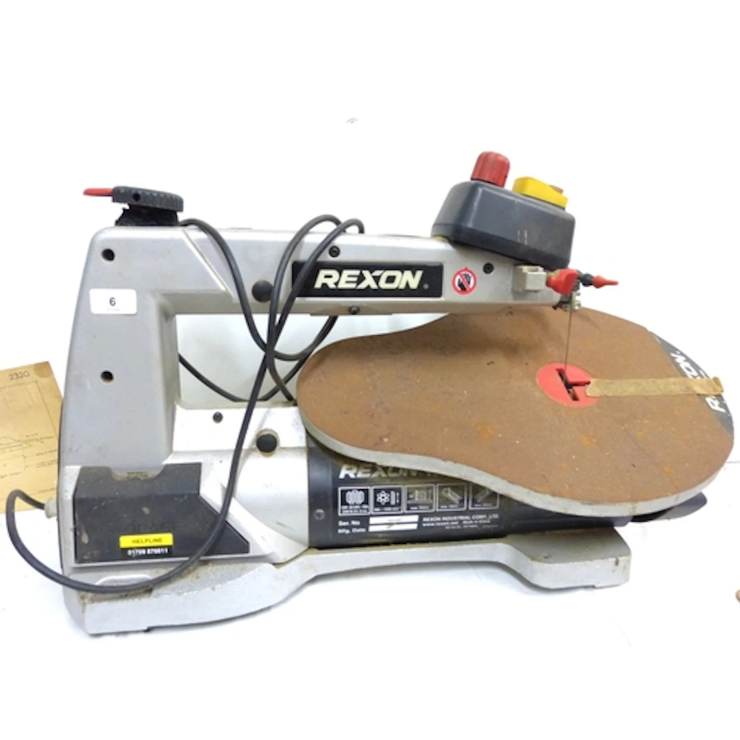 Electric Rexon fret saw with adjustable bed.