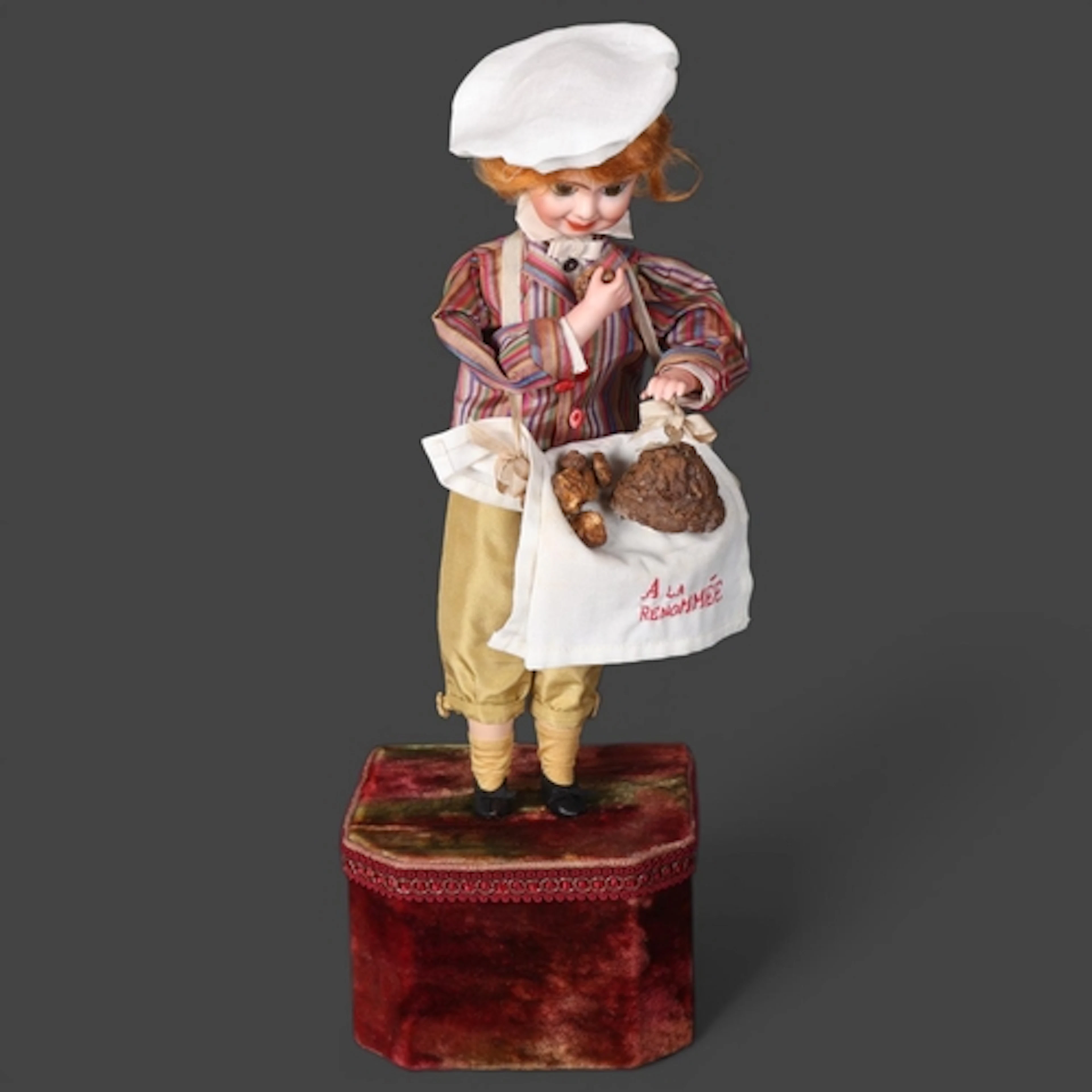 A bisque-headed musical automaton doll, Little Pastry Chef W...