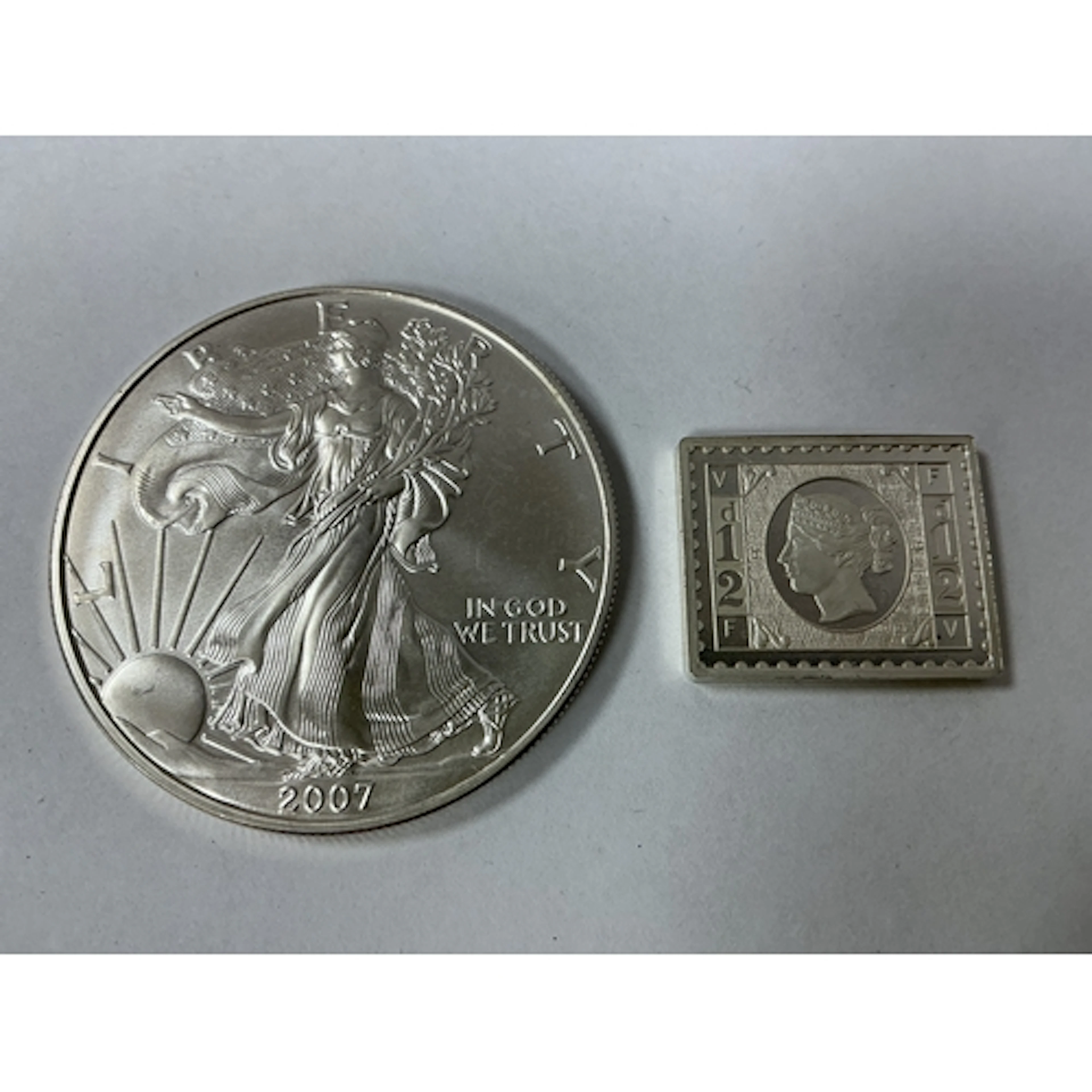 2007 USA Fine Silver One Ounce Liberty Dollar, together with...