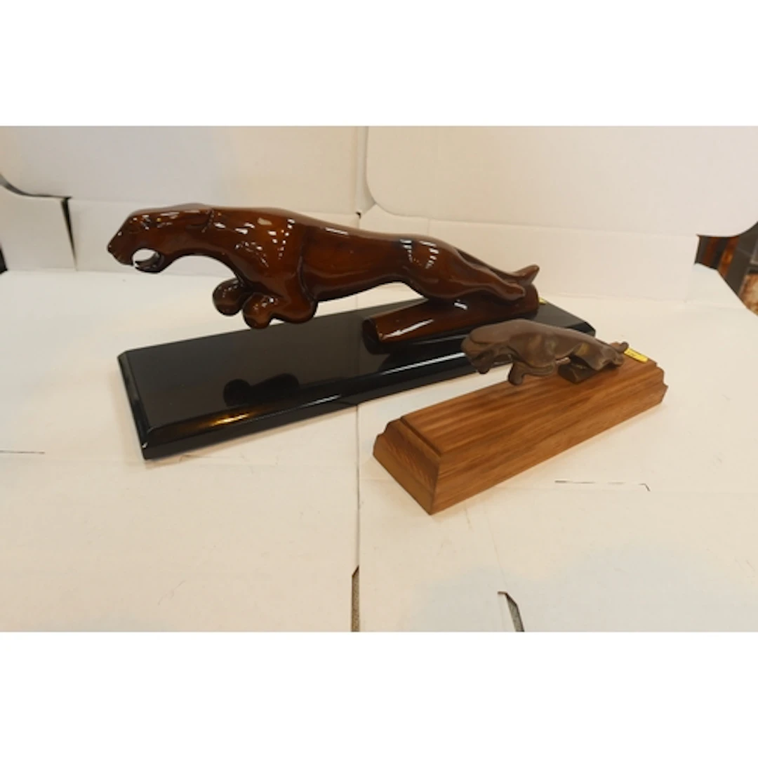 Wooden Jaguar model and a cast Jaguar model