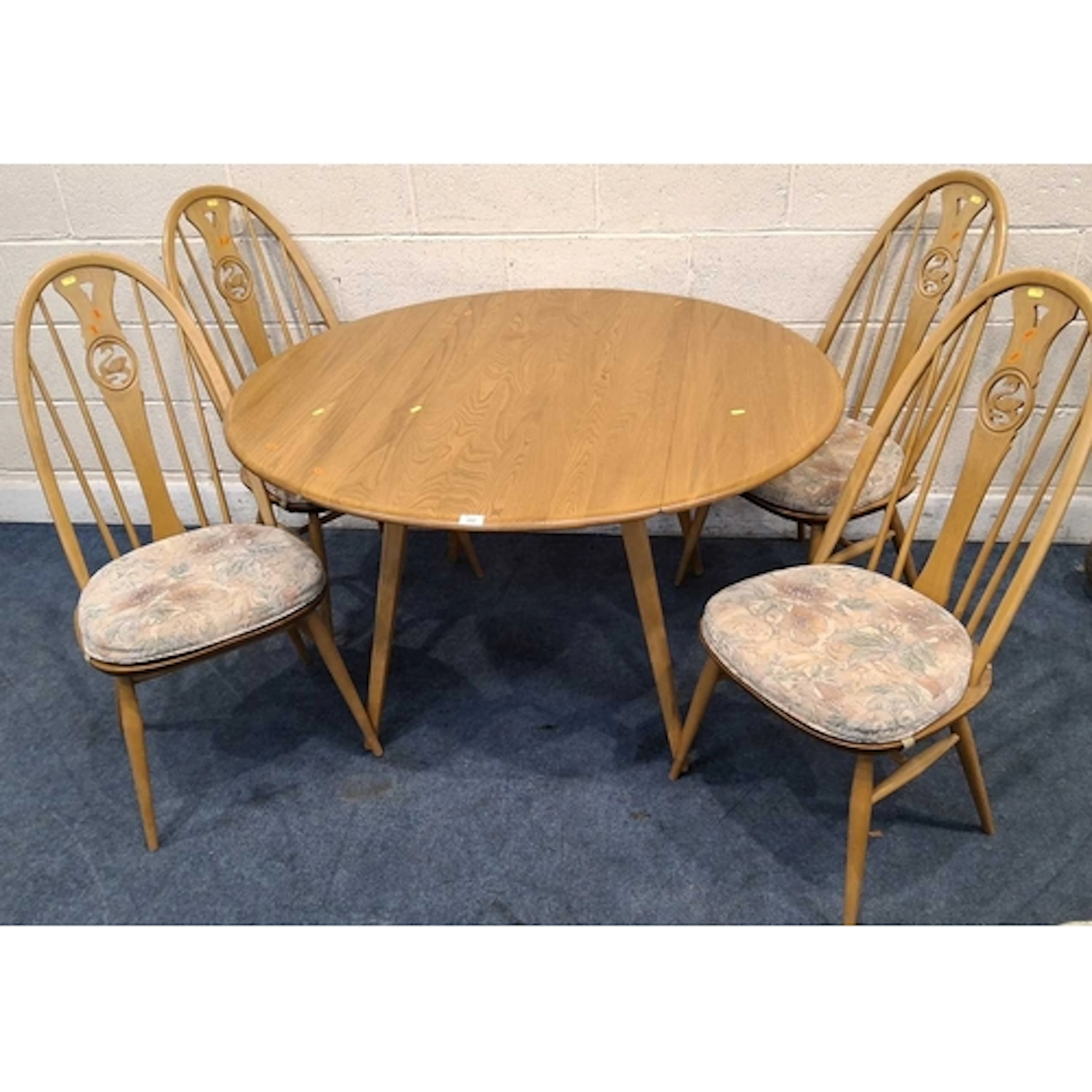 LUCIAN ERCOLANI, A MID-CENTURY ELM AND BEECH DROP LEAF TABLE...