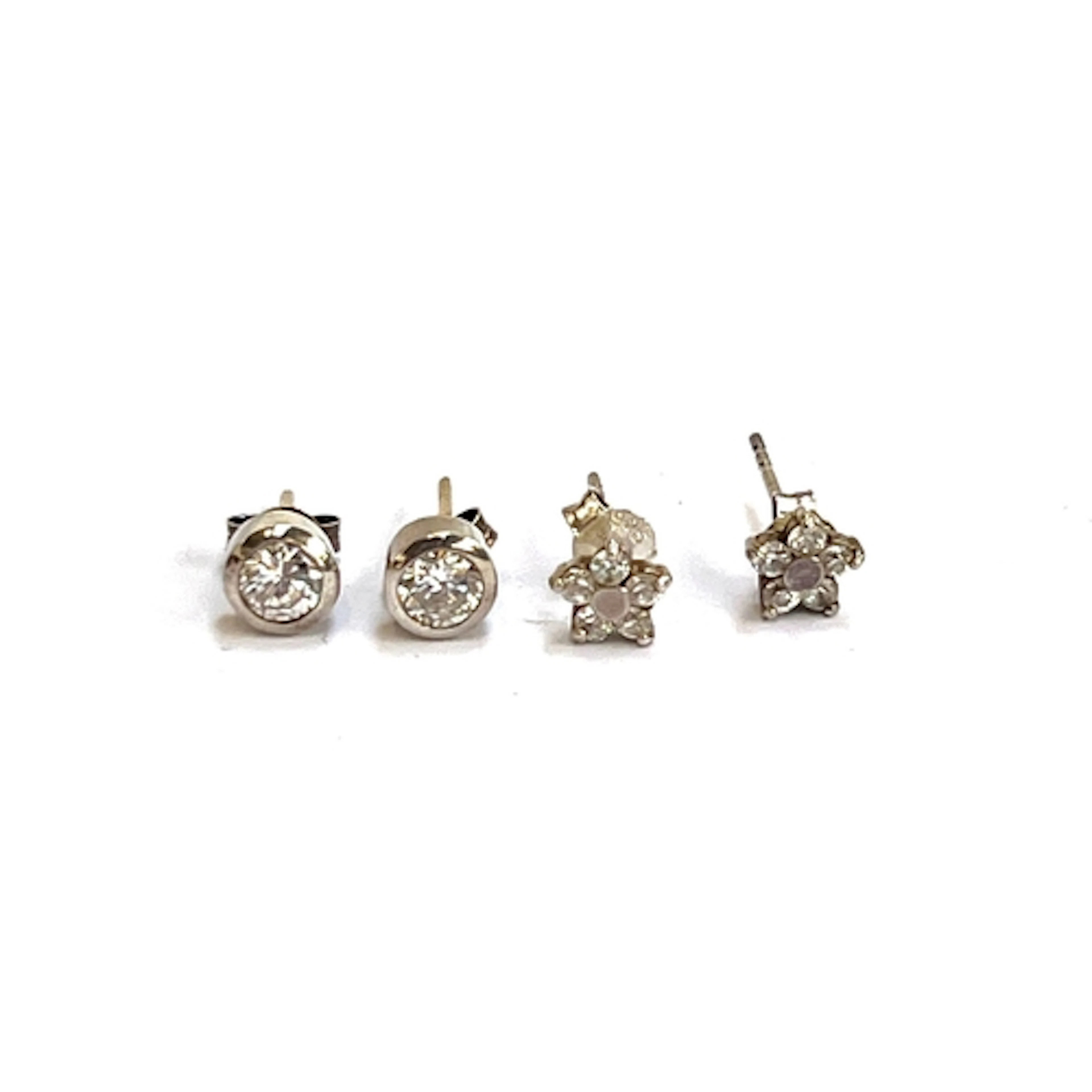 Two pairs of 925 silver stud earrings, one pair floral clust...