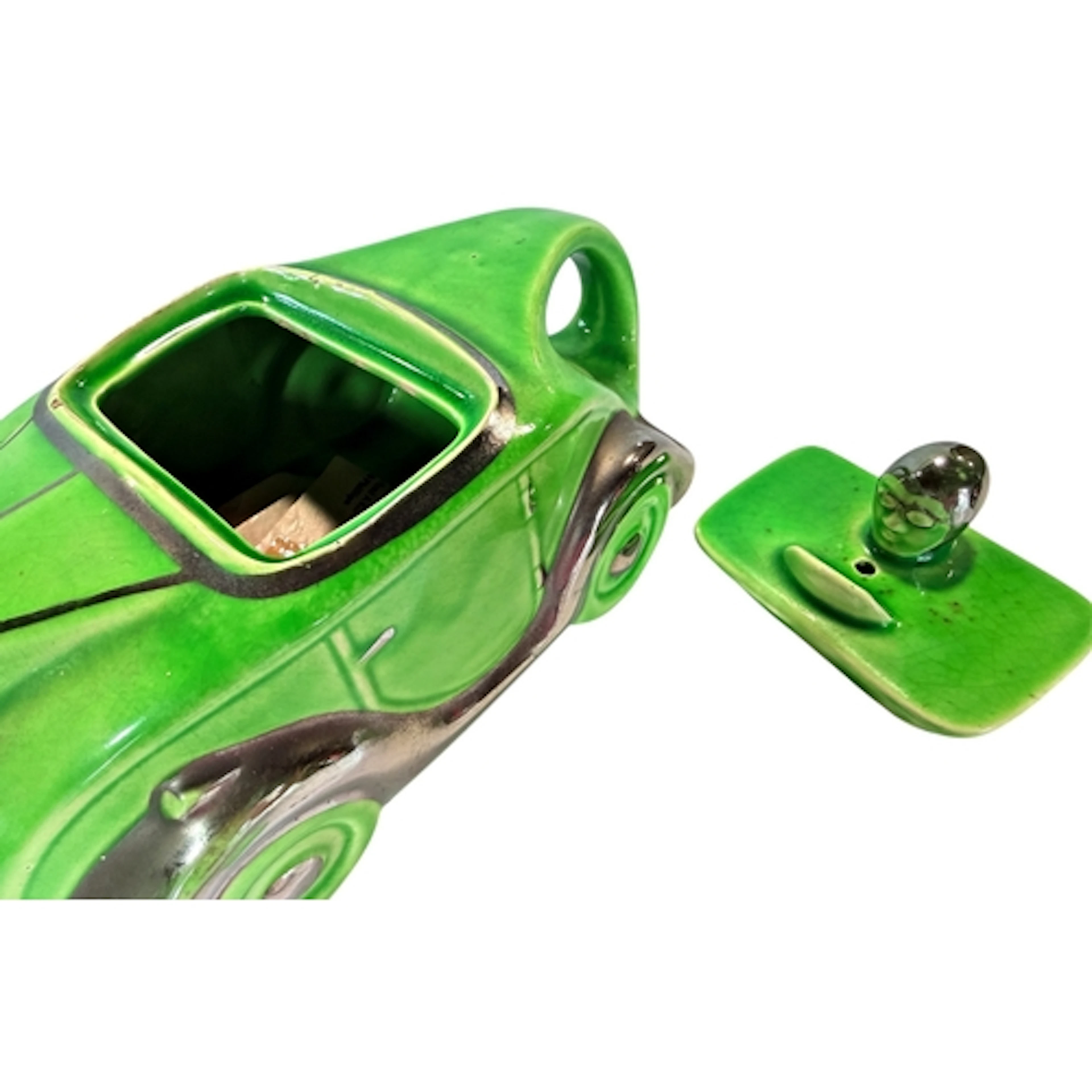 A mid 20th century green porcelain 'racing car' teapot, toge...