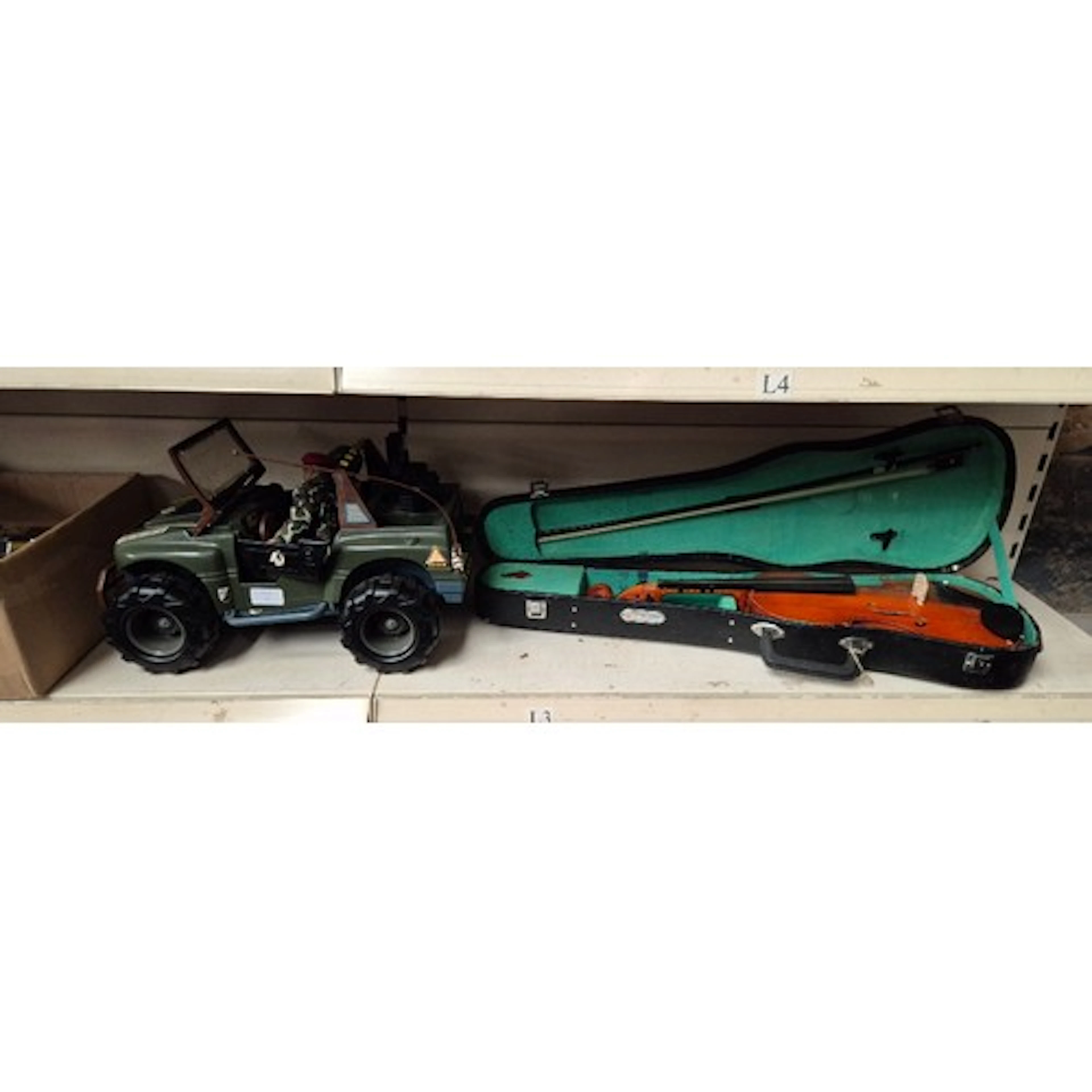 An Action Man truck with 2 figures together with a violin in...