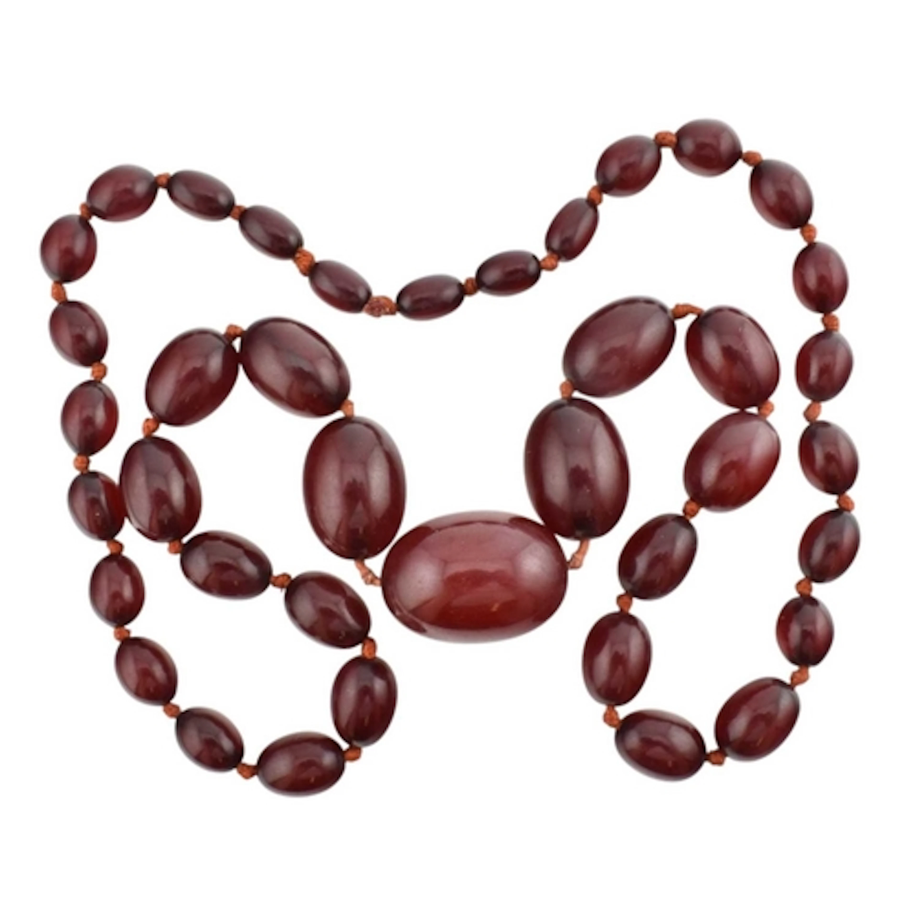 A vintage cherry amber Bakelite bead necklace. The necklace ...