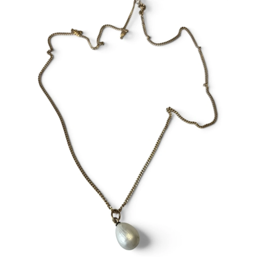 A Russian Enamel egg on a Gold chain.