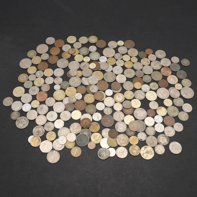 WORLD COINS: A COLLECTION OF COINS FROM DIVERSE COUNTRIES IN...