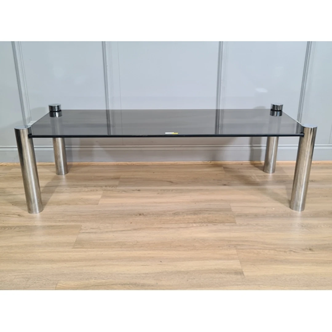 A smoked glass top Coffee Table on tubular metal supports, 4...
