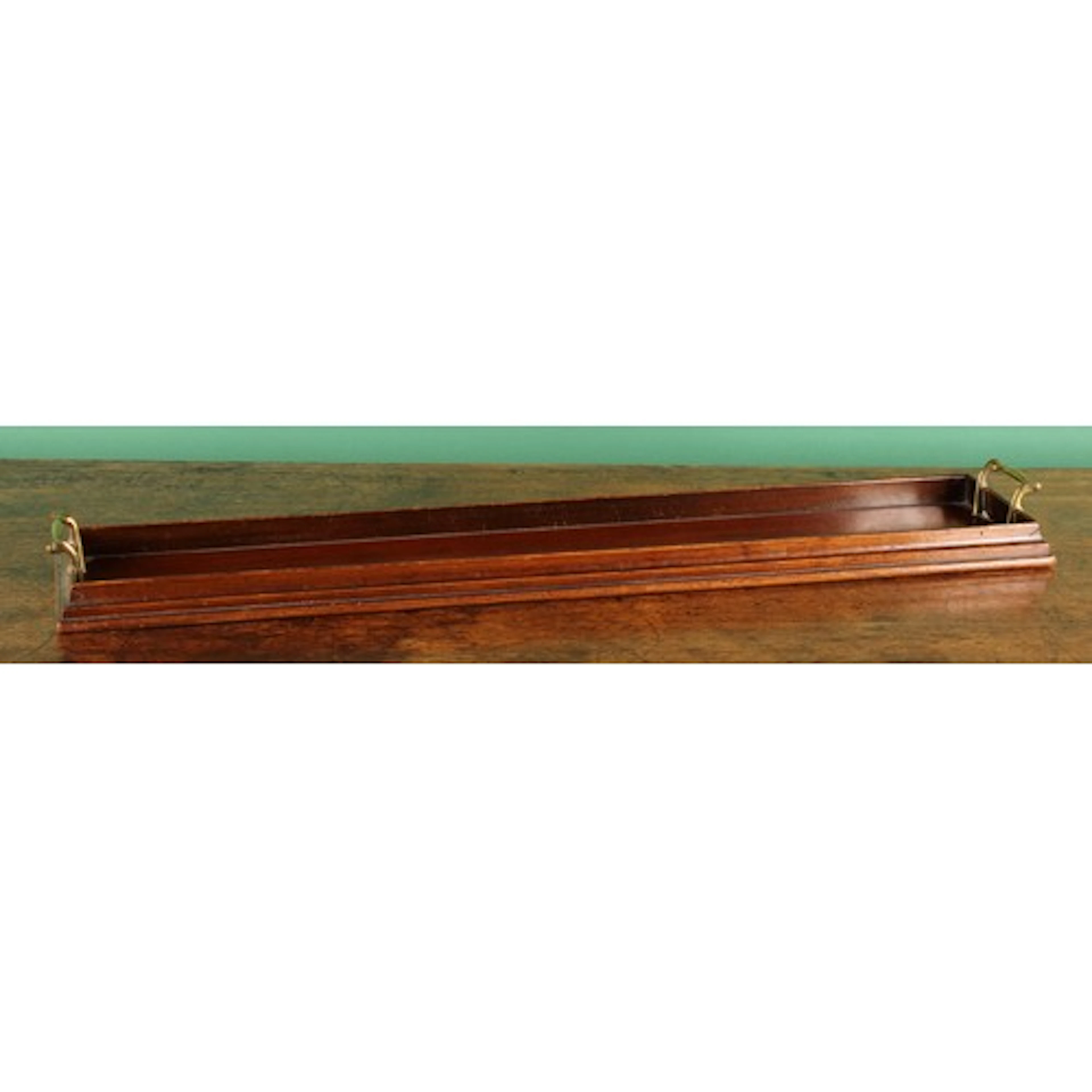 An Edwardian mahogany rectangular decanter tray, of elongate...