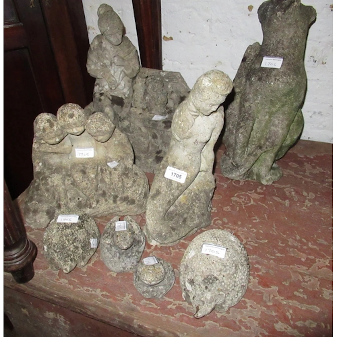 Four various small cast concrete garden figures, marble mort...