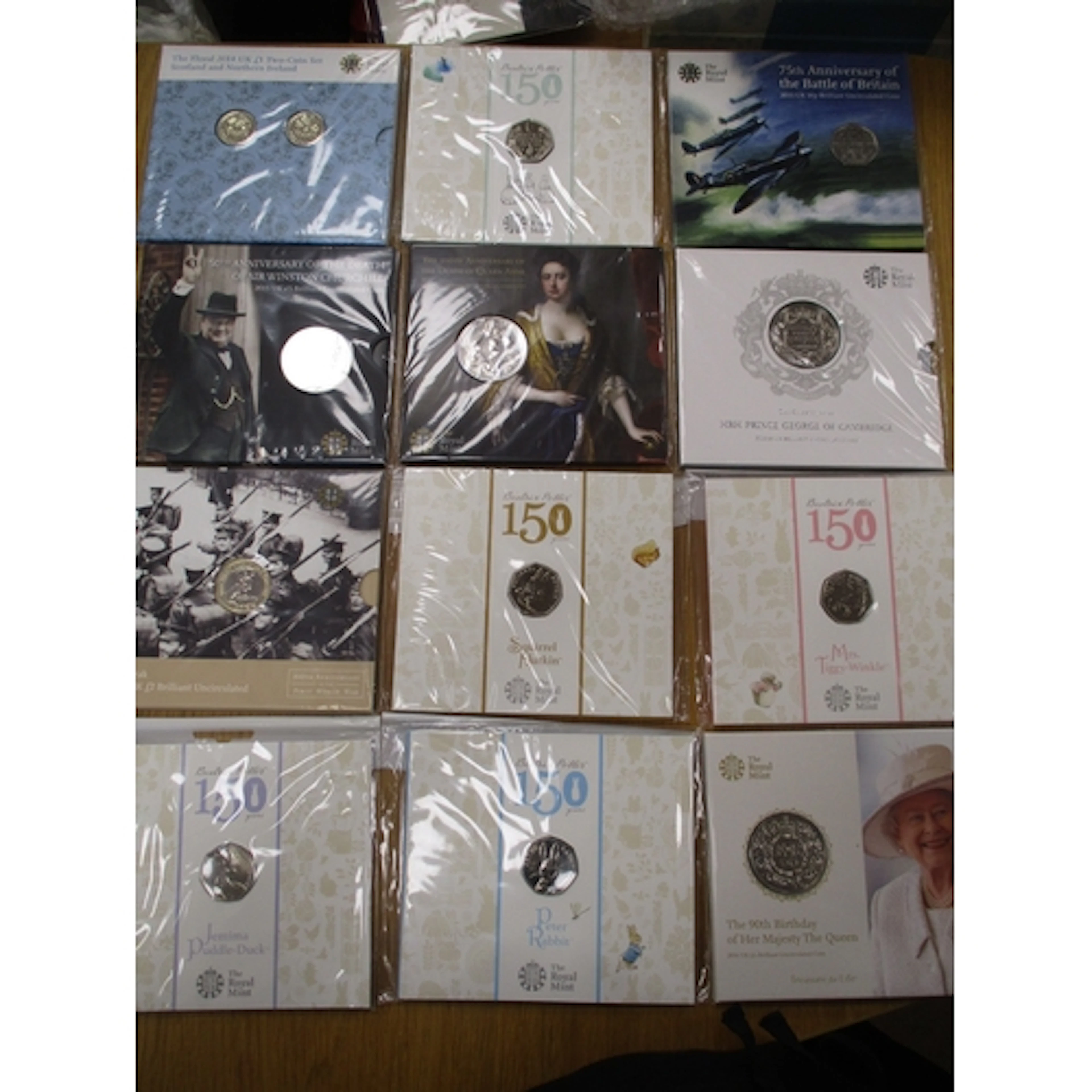 Collection of Royal Mint uncirculated folders, including £5 ...