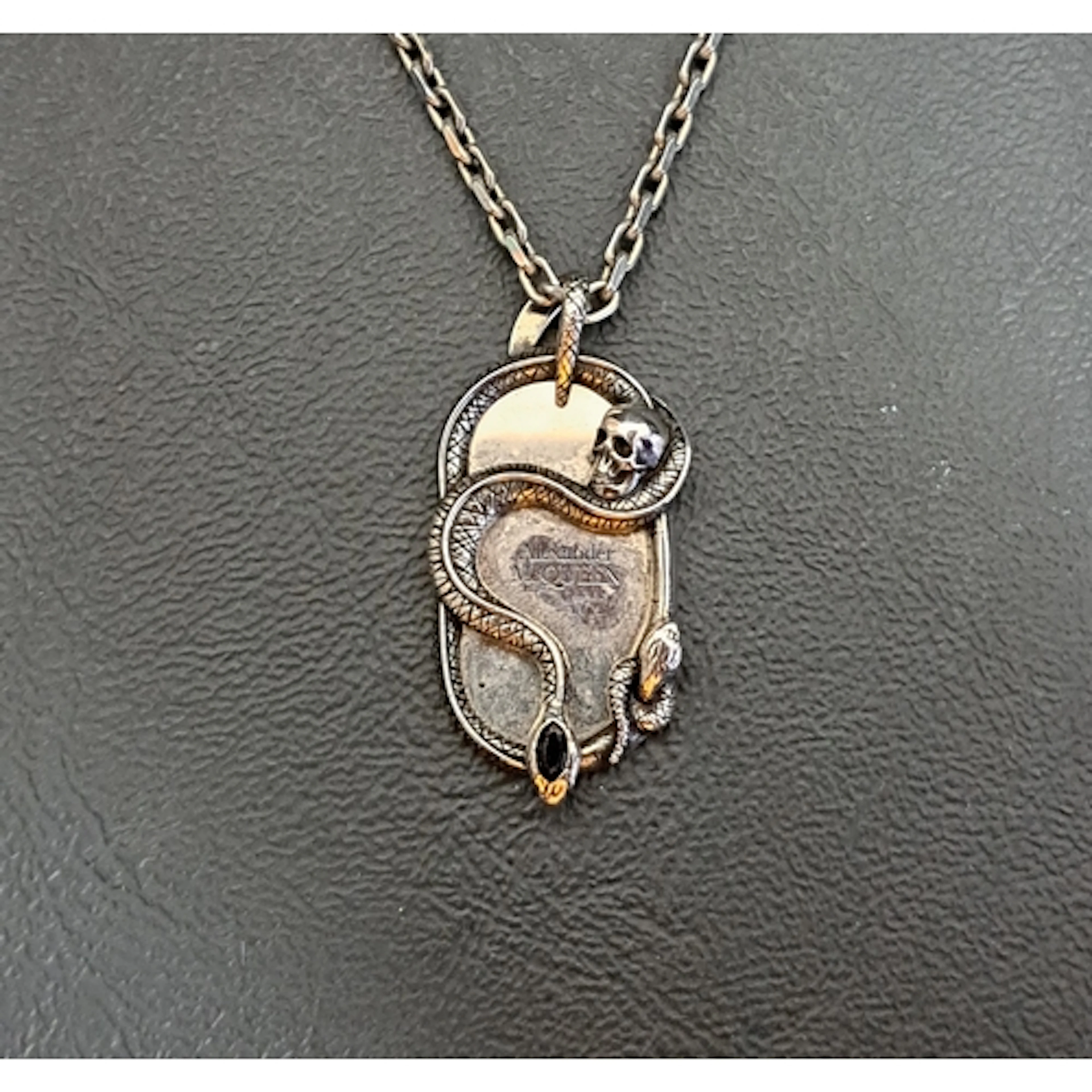 ALEXANDER MCQUEEN SNAKE AND SKULL PENDANT in silver tone and...
