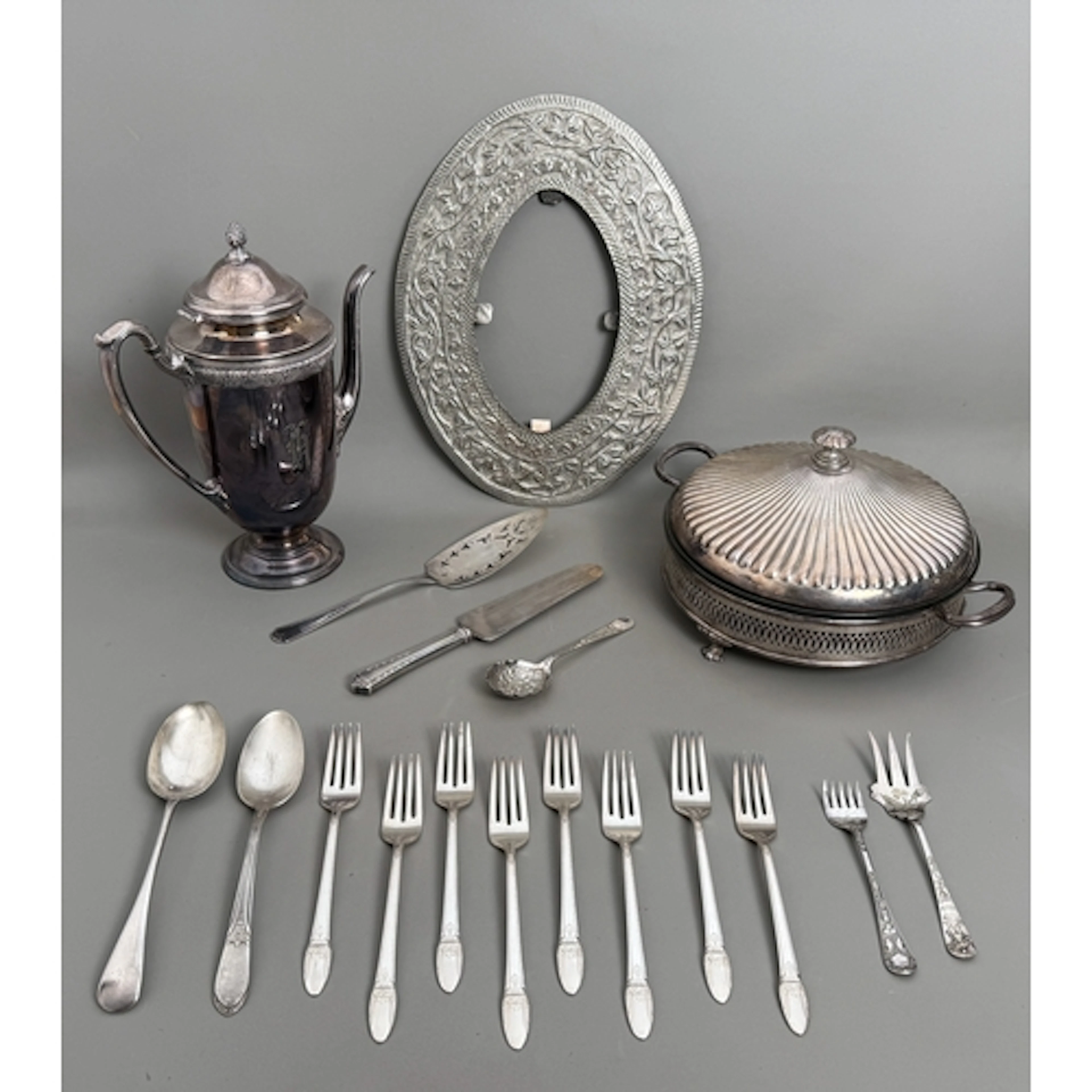 A group of silver plated items - to include a hot water pot,...