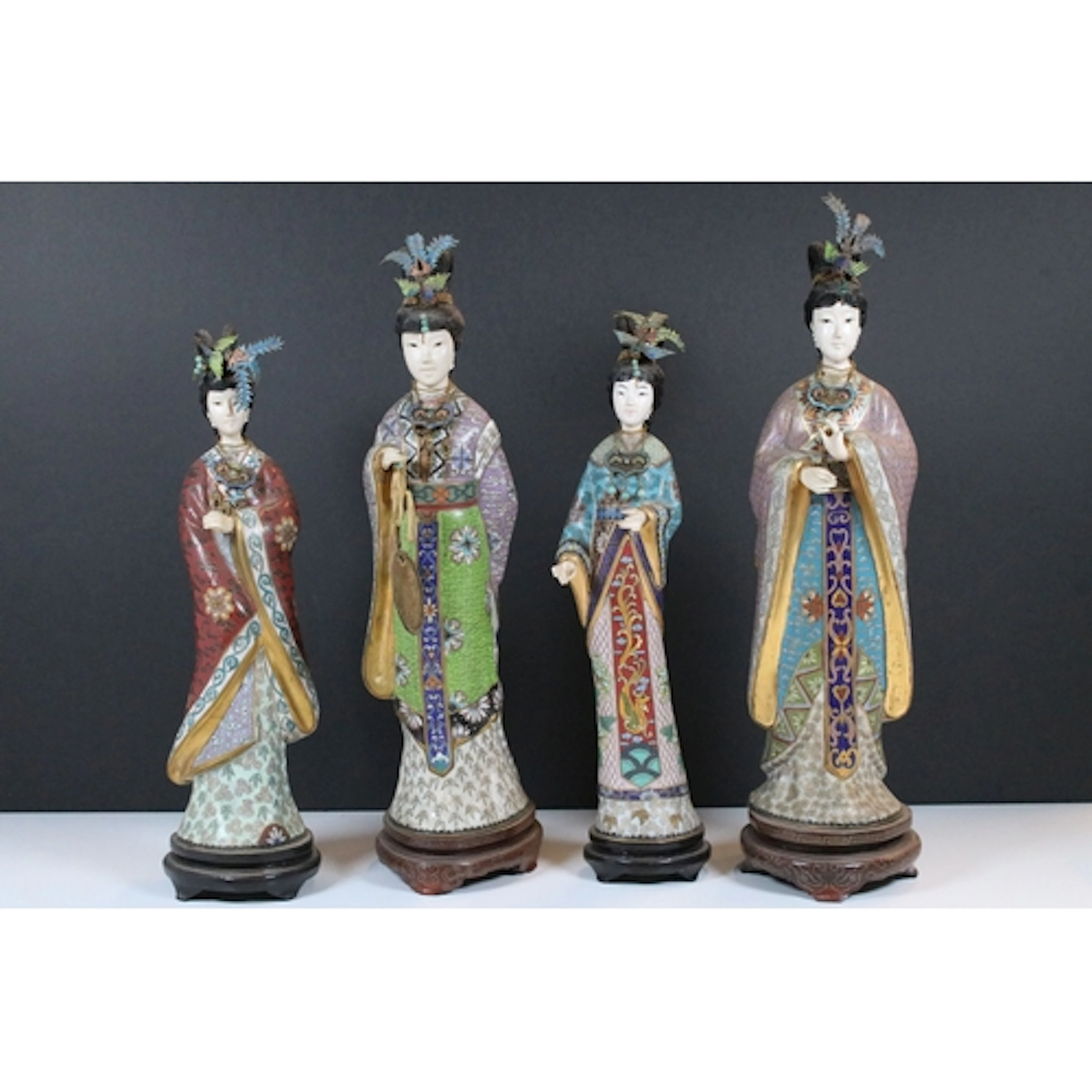 Four 20th century cloisonne geishas, each raised on a hardwo...