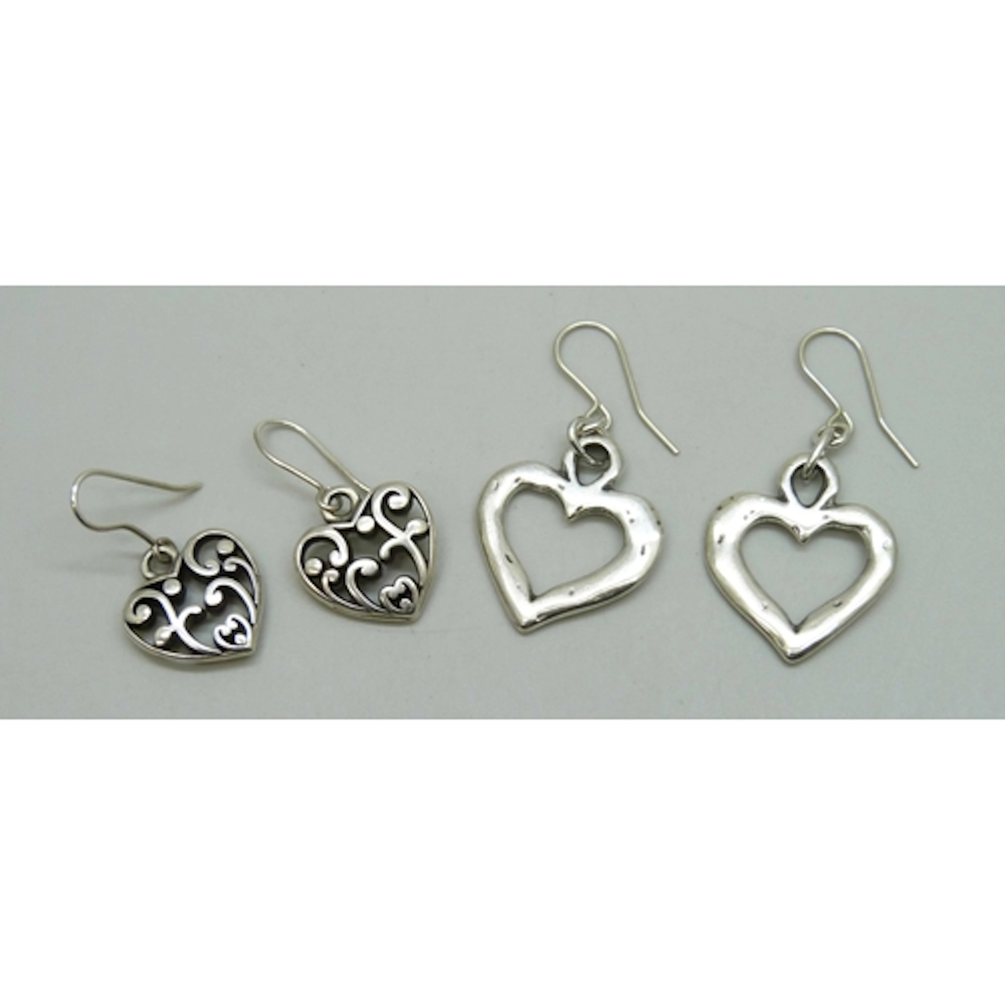 Two pairs of silver plated heart design drop earrings, on 92...