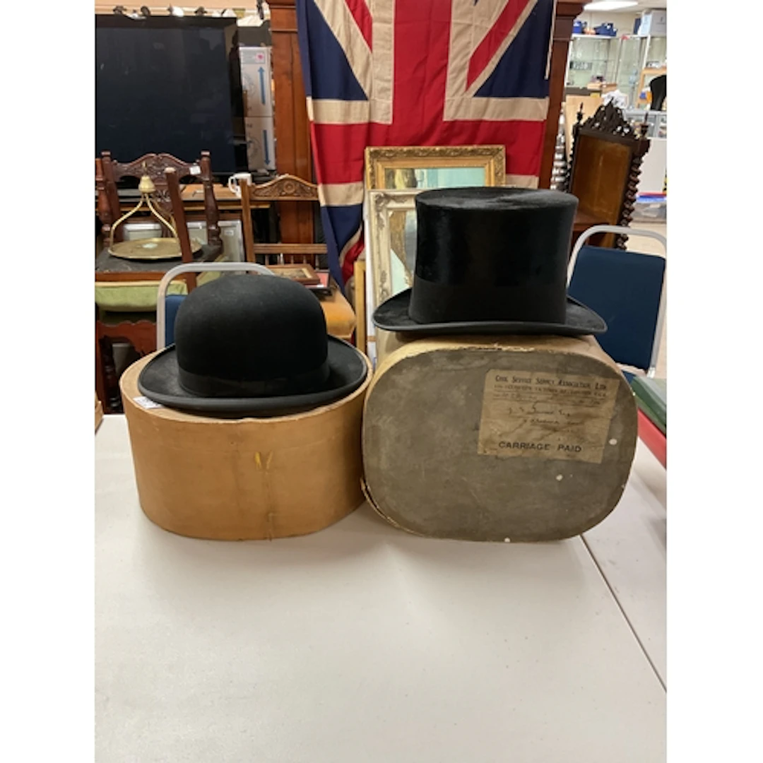 Cased bowler and top hat good condition.