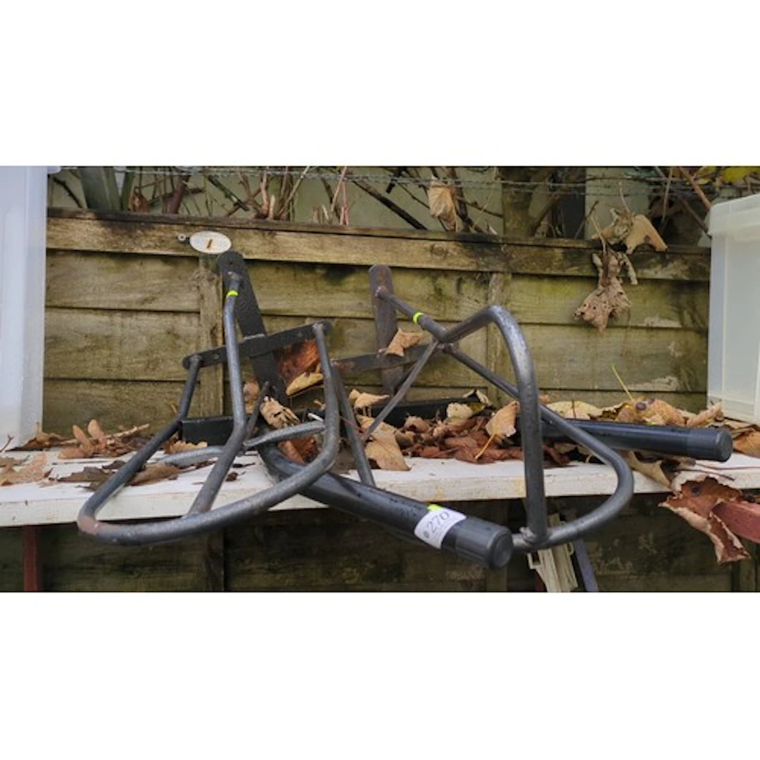 A group of tubular steel saddle racks.