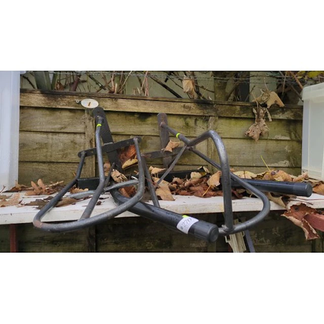 A group of tubular steel saddle racks.