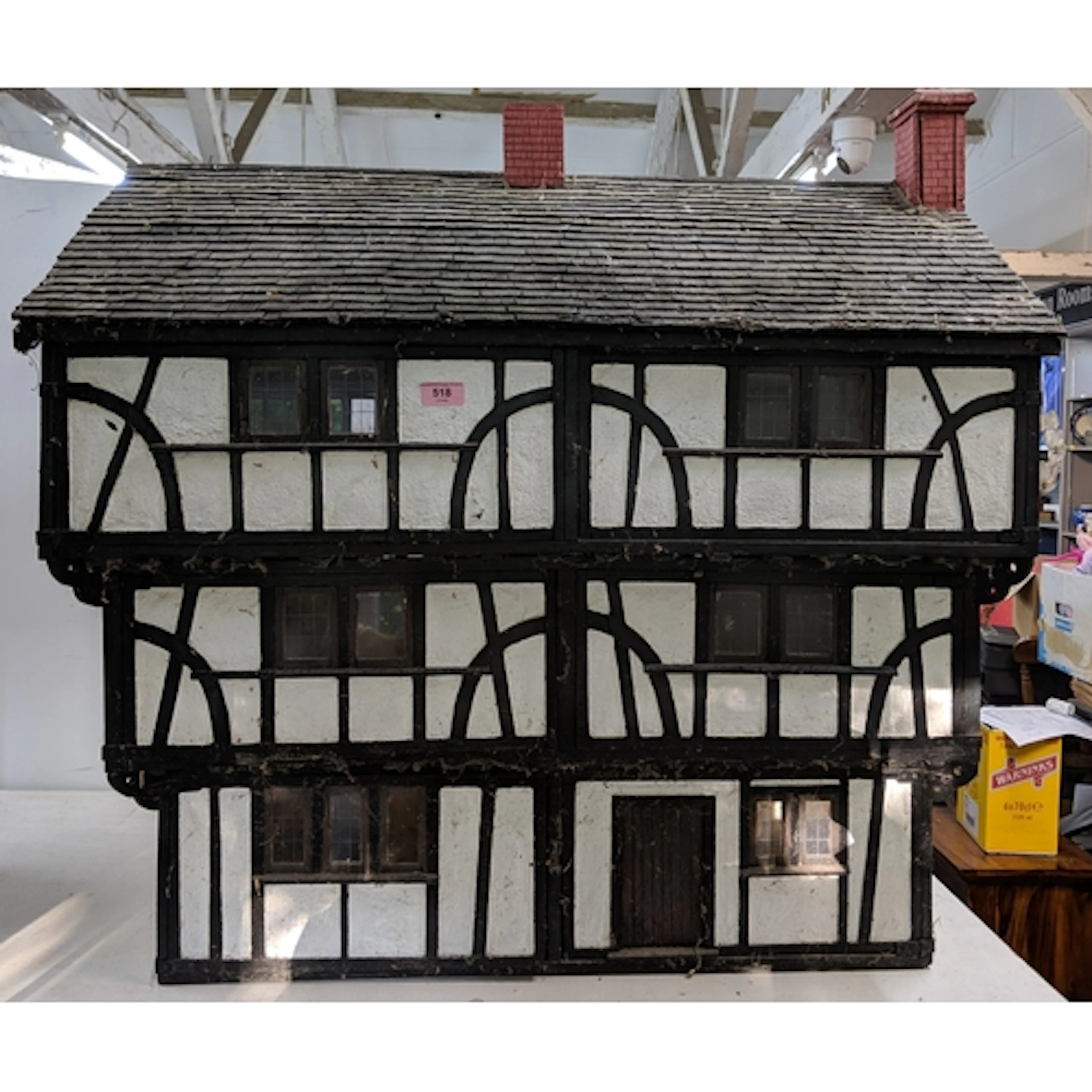 A handmade Tudor style dolls house with half timbered decora...