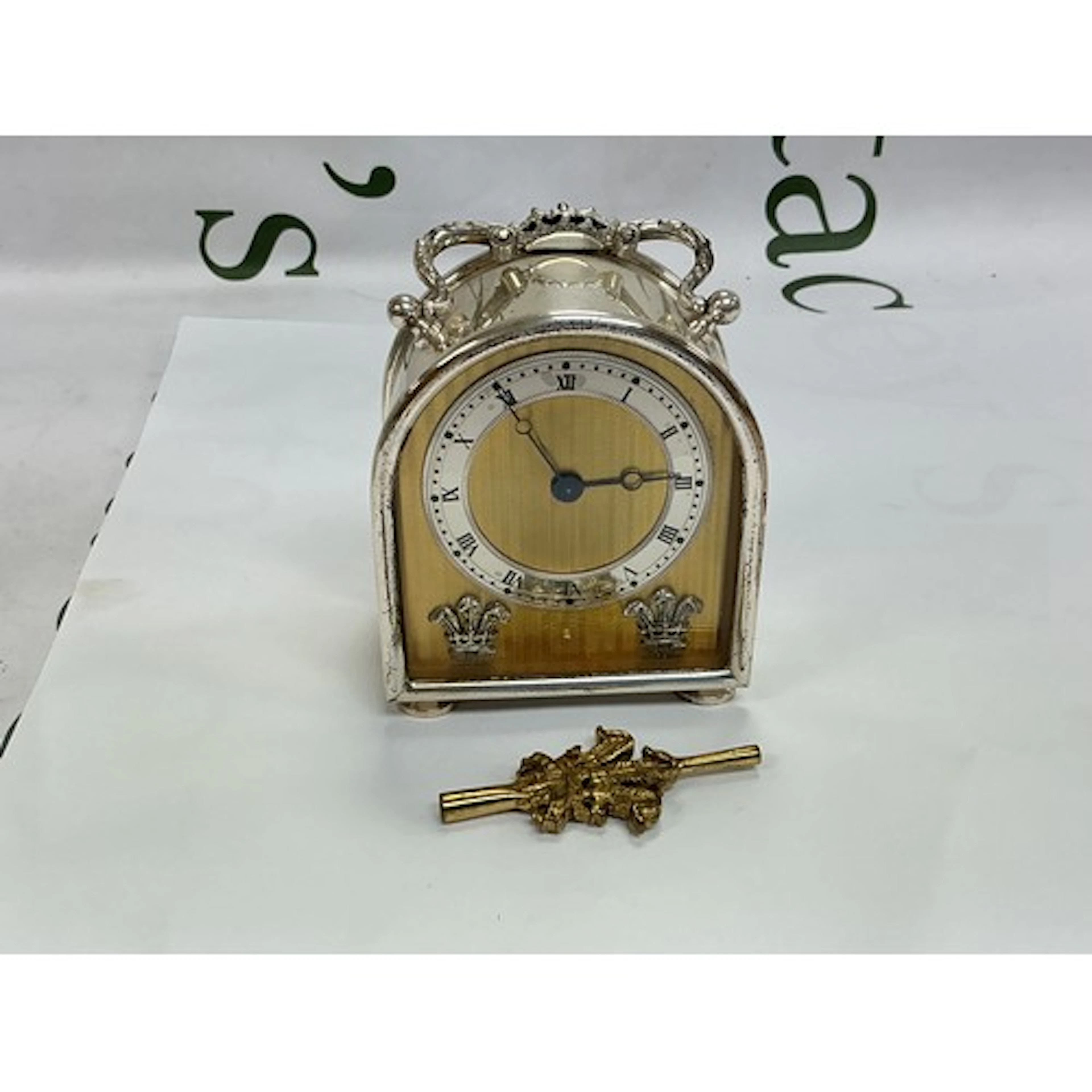 A silver cased carriage clock with flour de Ltd decoration t...