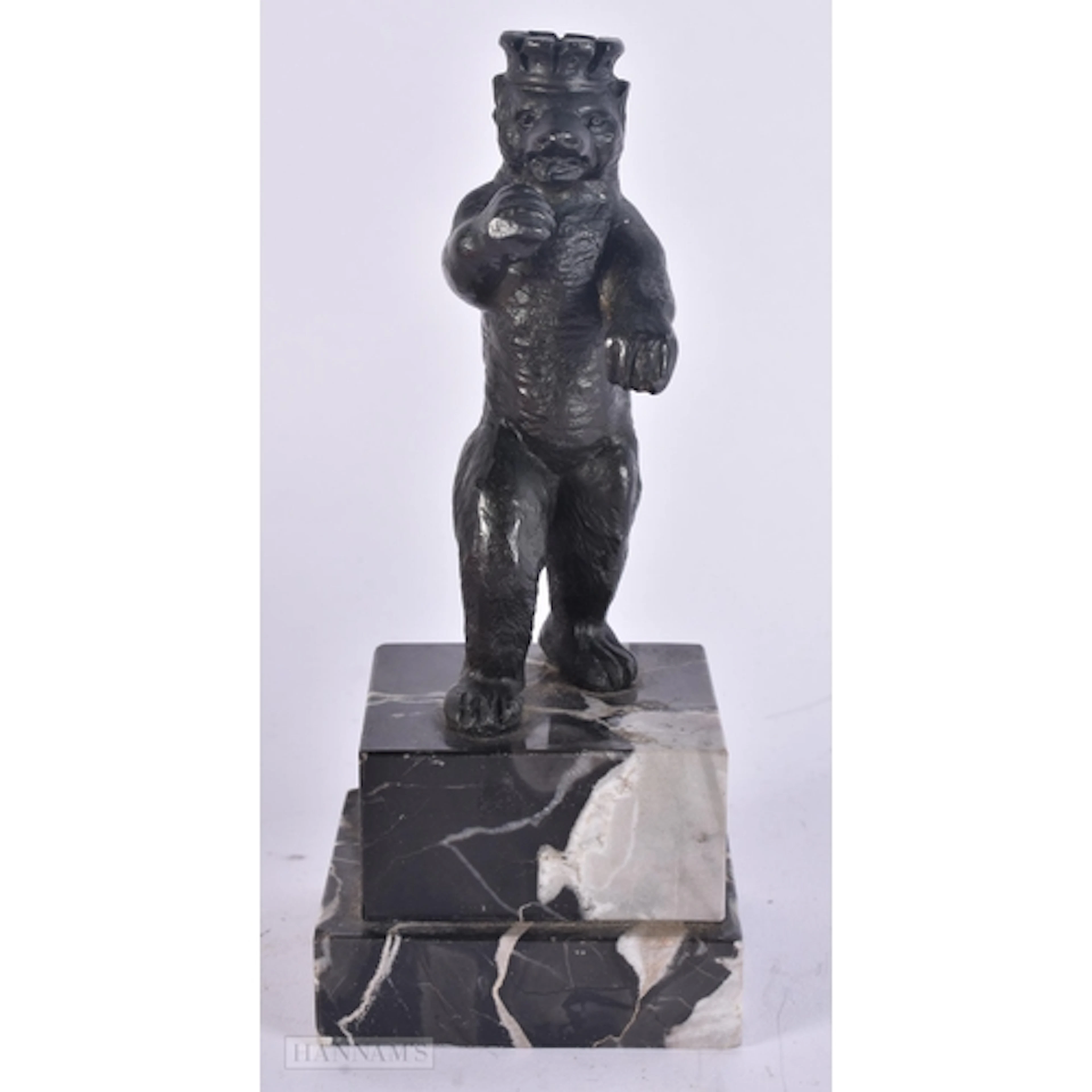 AN ART DECO BRONZE FIGURE OF A CROWNED BEAR. 16.5 cm high.