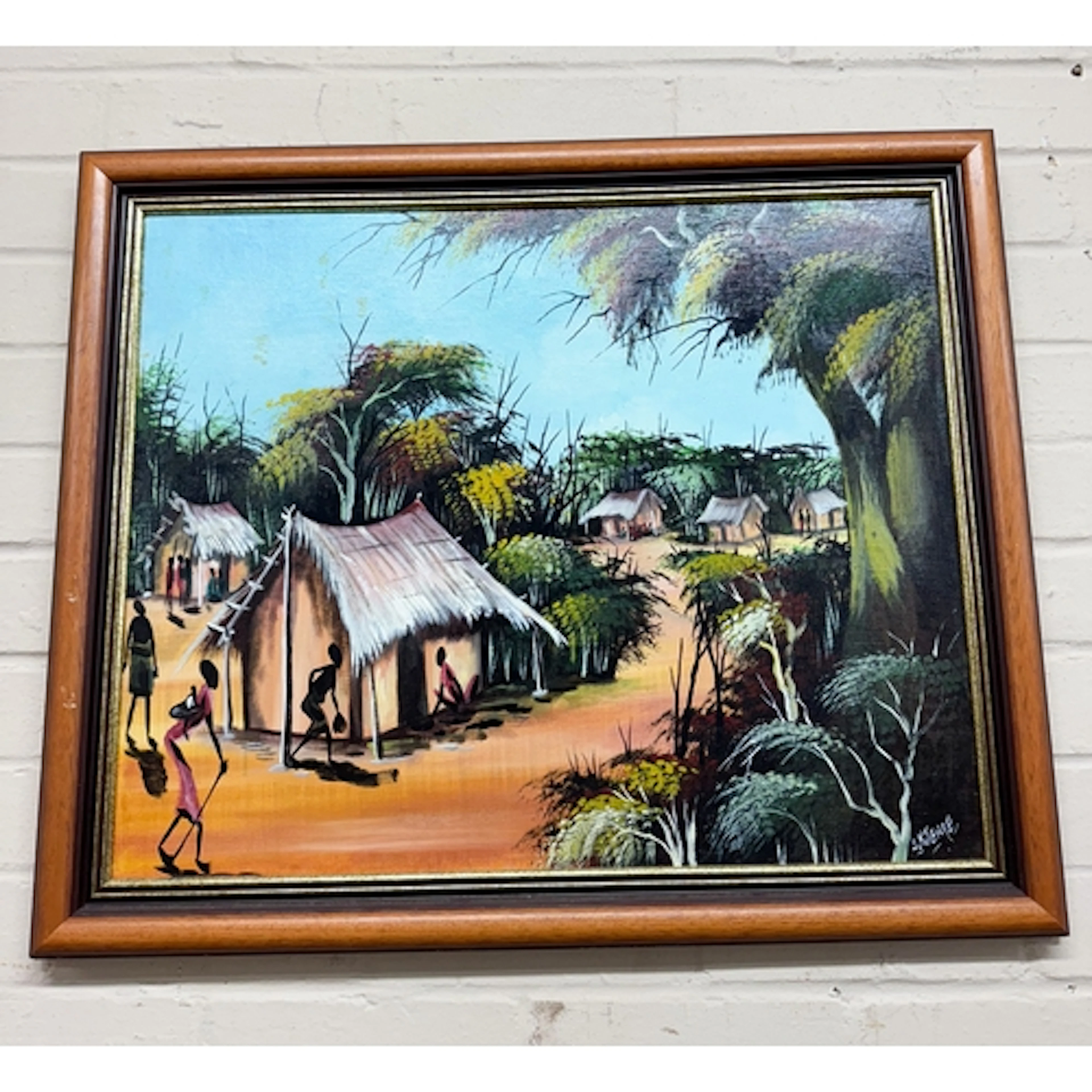 A bevelled wall mirror in pine frame and an oil painting of ...