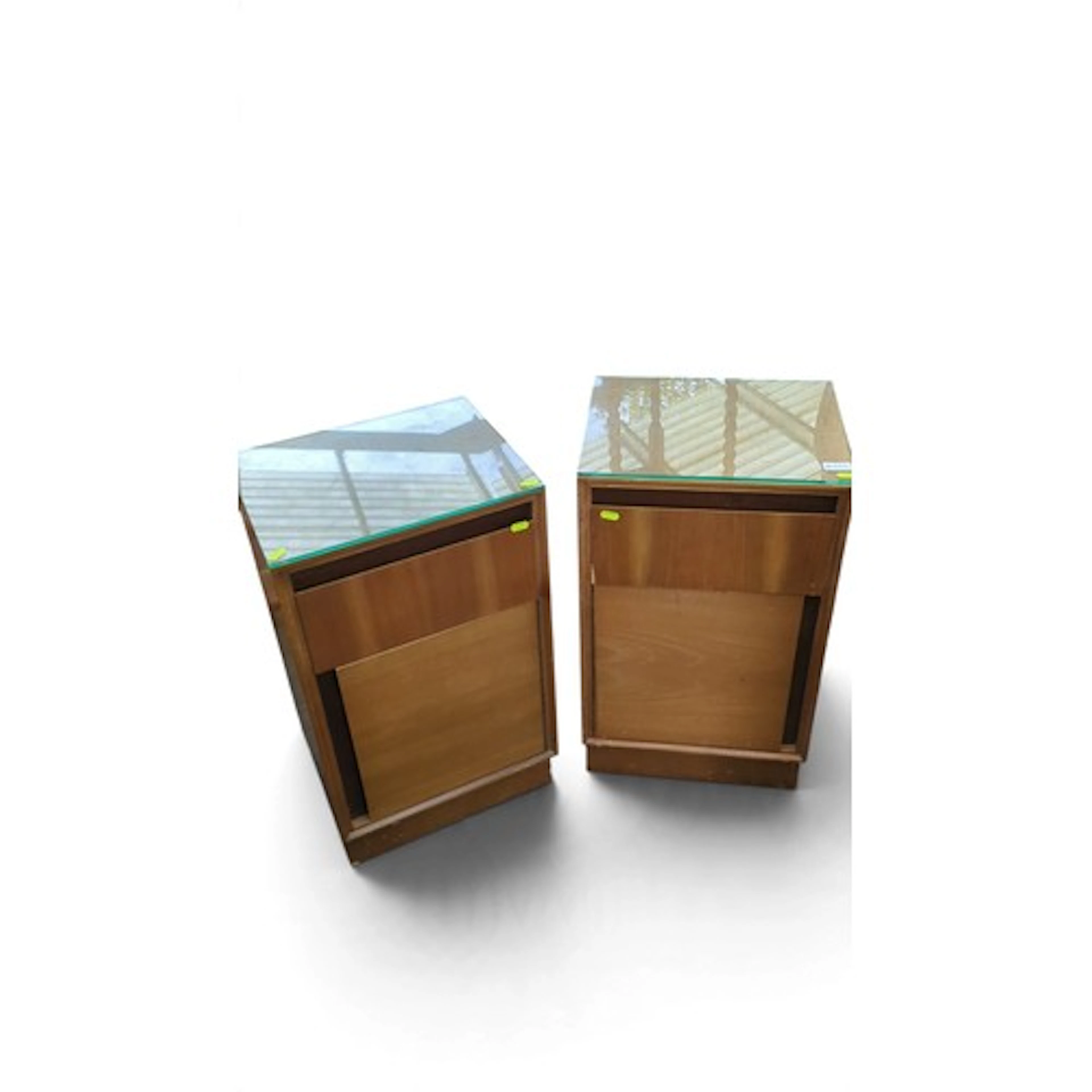 A pair of mid-century bedside cabinets, each with a rectangu...