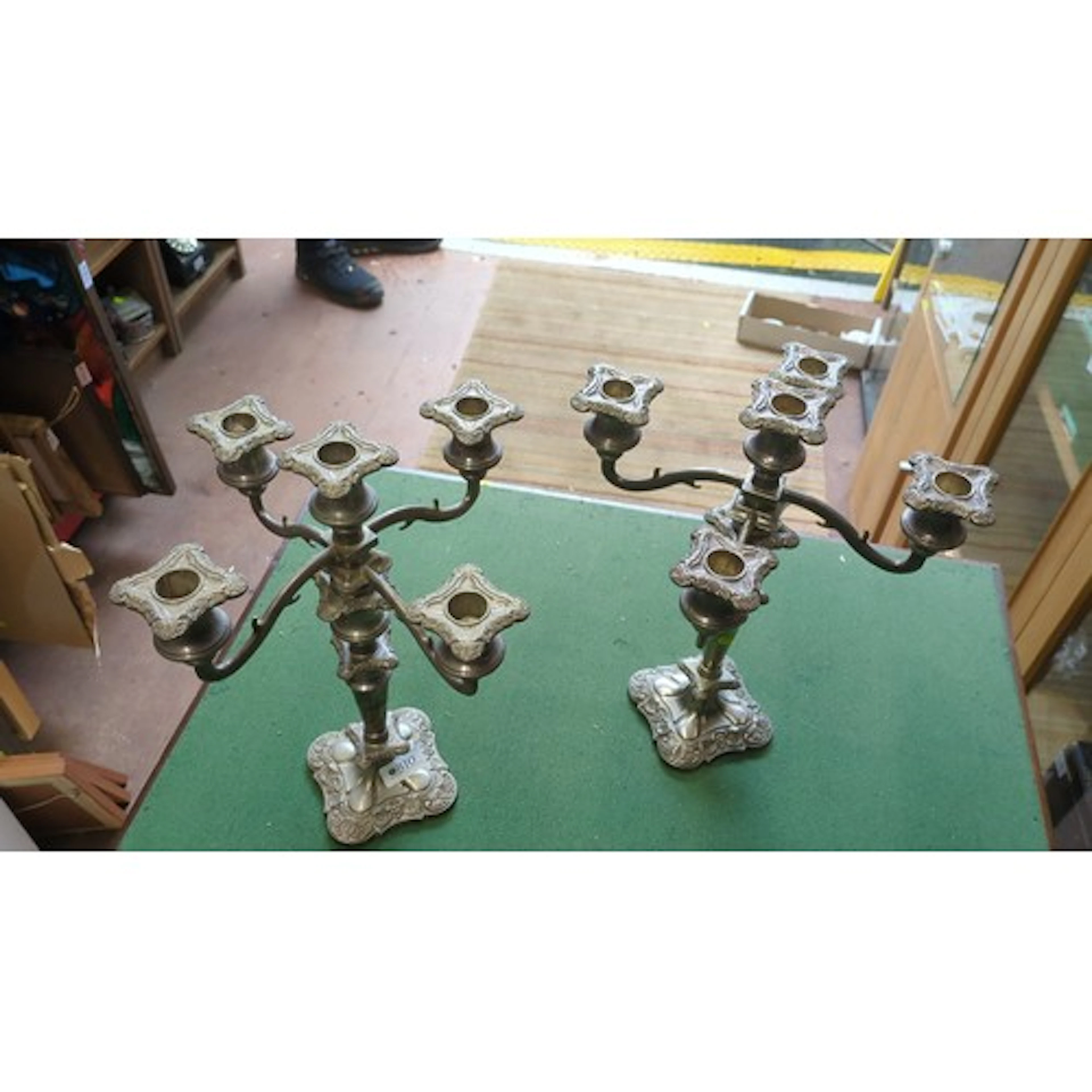 A pair of Victorian-style silver-plated five-light candelabr...