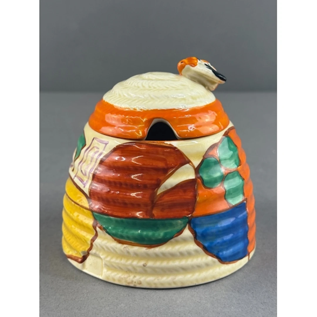 Ceramics: a Clarice Cliff Orange Melon beehive honey pot, ma...