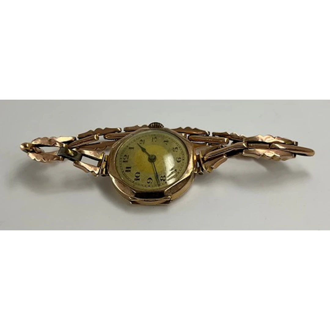 An Art Deco 9ct gold lady's watch, case and links stamped 9c...