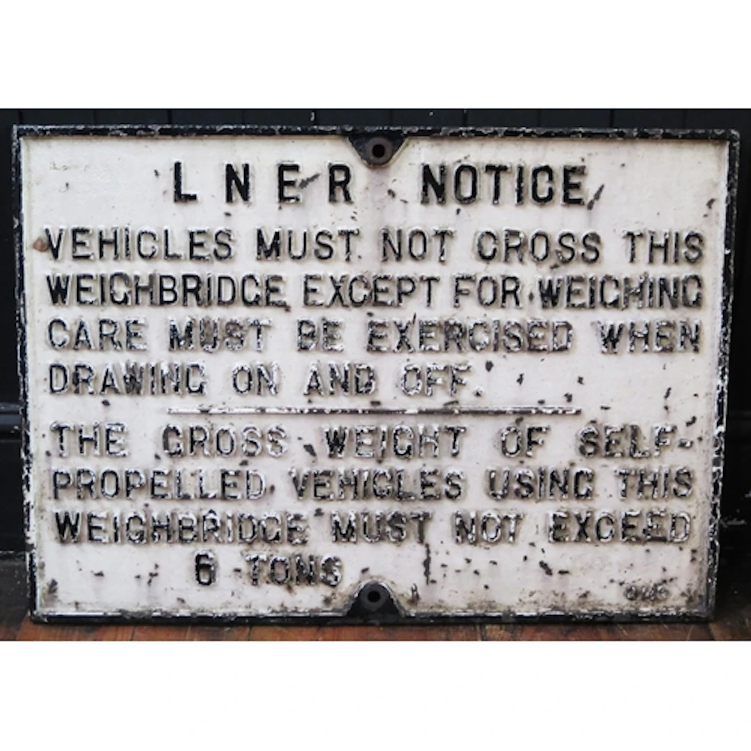 A L.N.E.R. cast iron sign "Vehicles Must Not Cross This Wei...