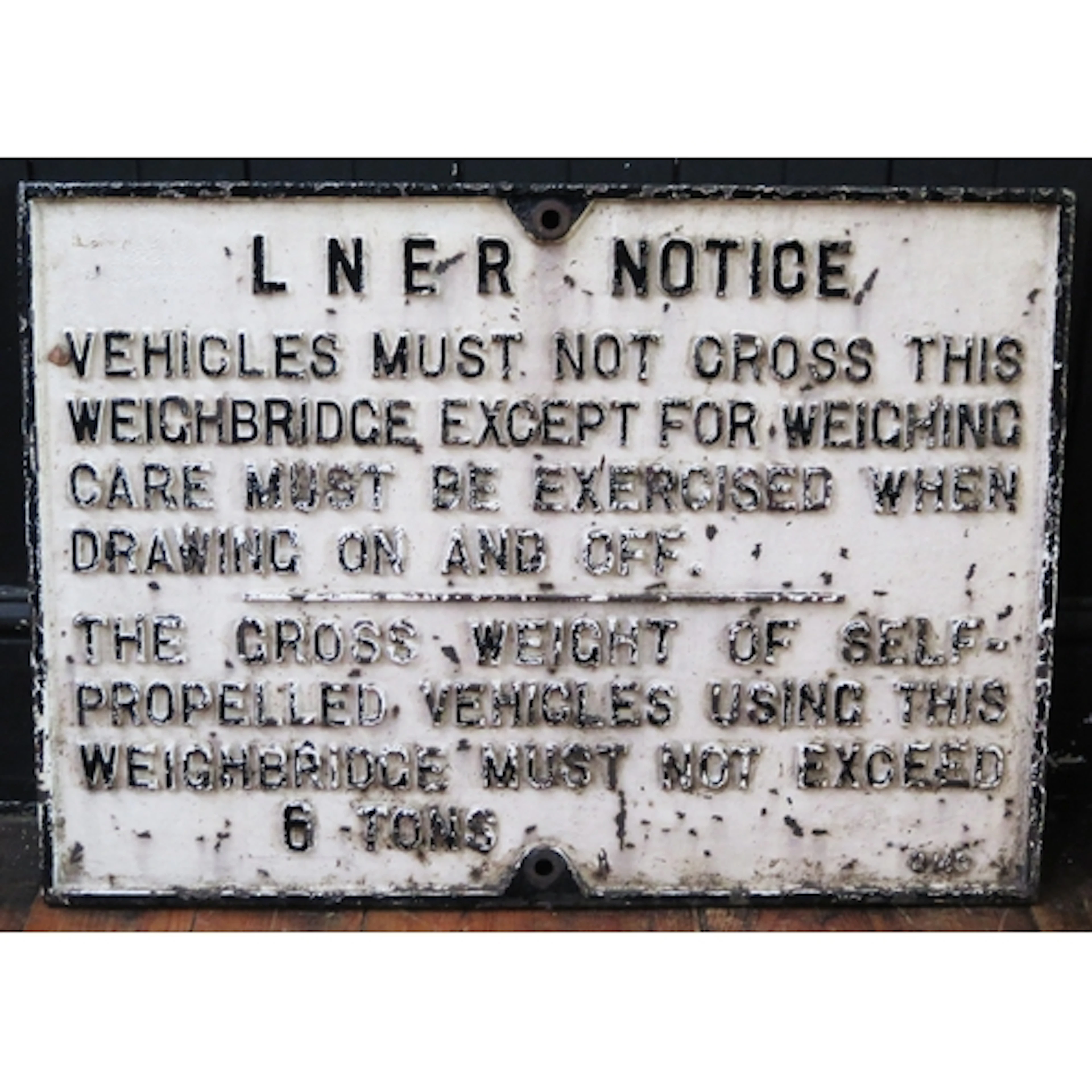 A L.N.E.R. cast iron sign "Vehicles Must Not Cross This Wei...