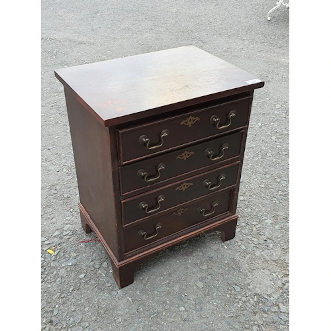 A small Chest fitted four short drawers raised on bracket fe...