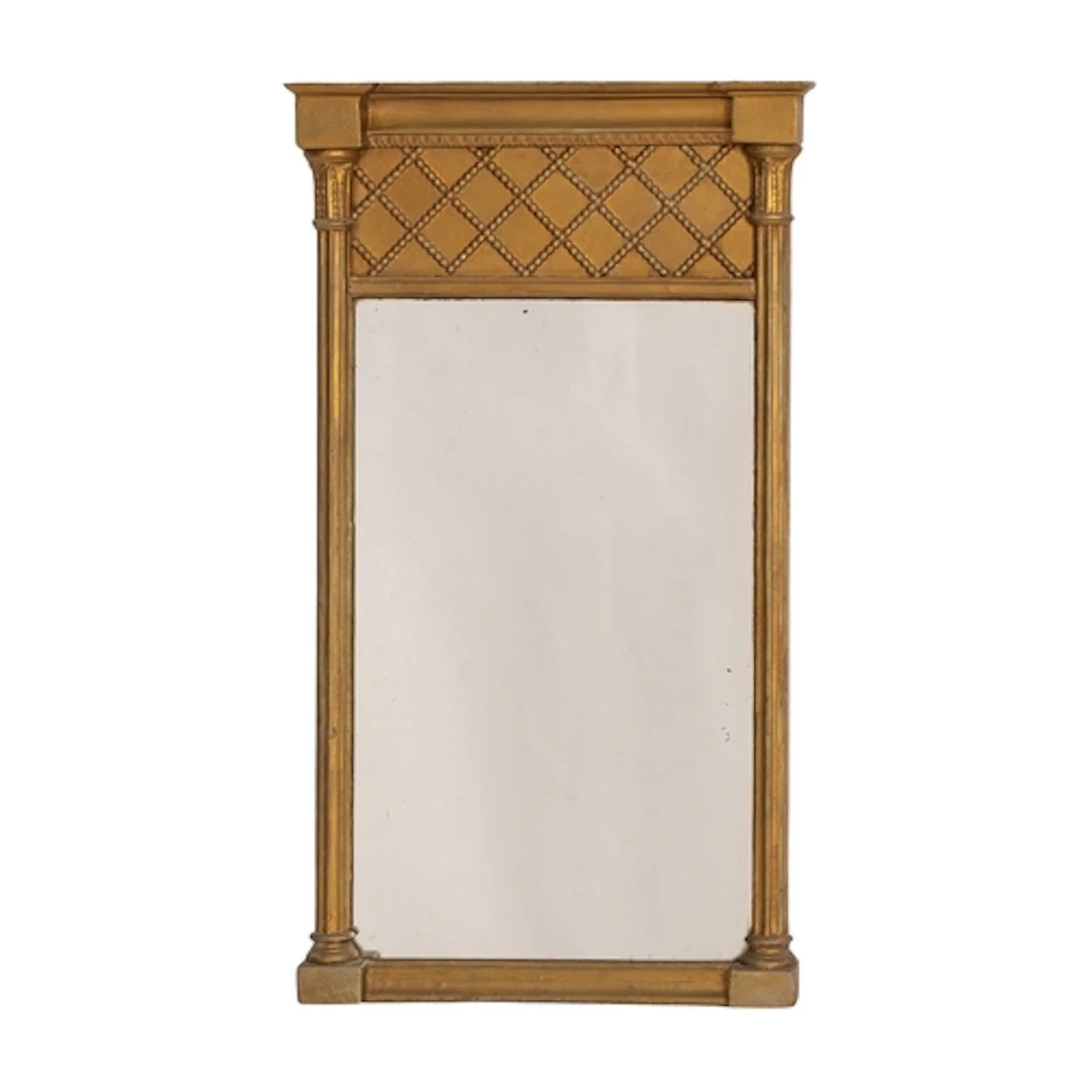 A giltwood and composition framed wall mirror in Regency sty...