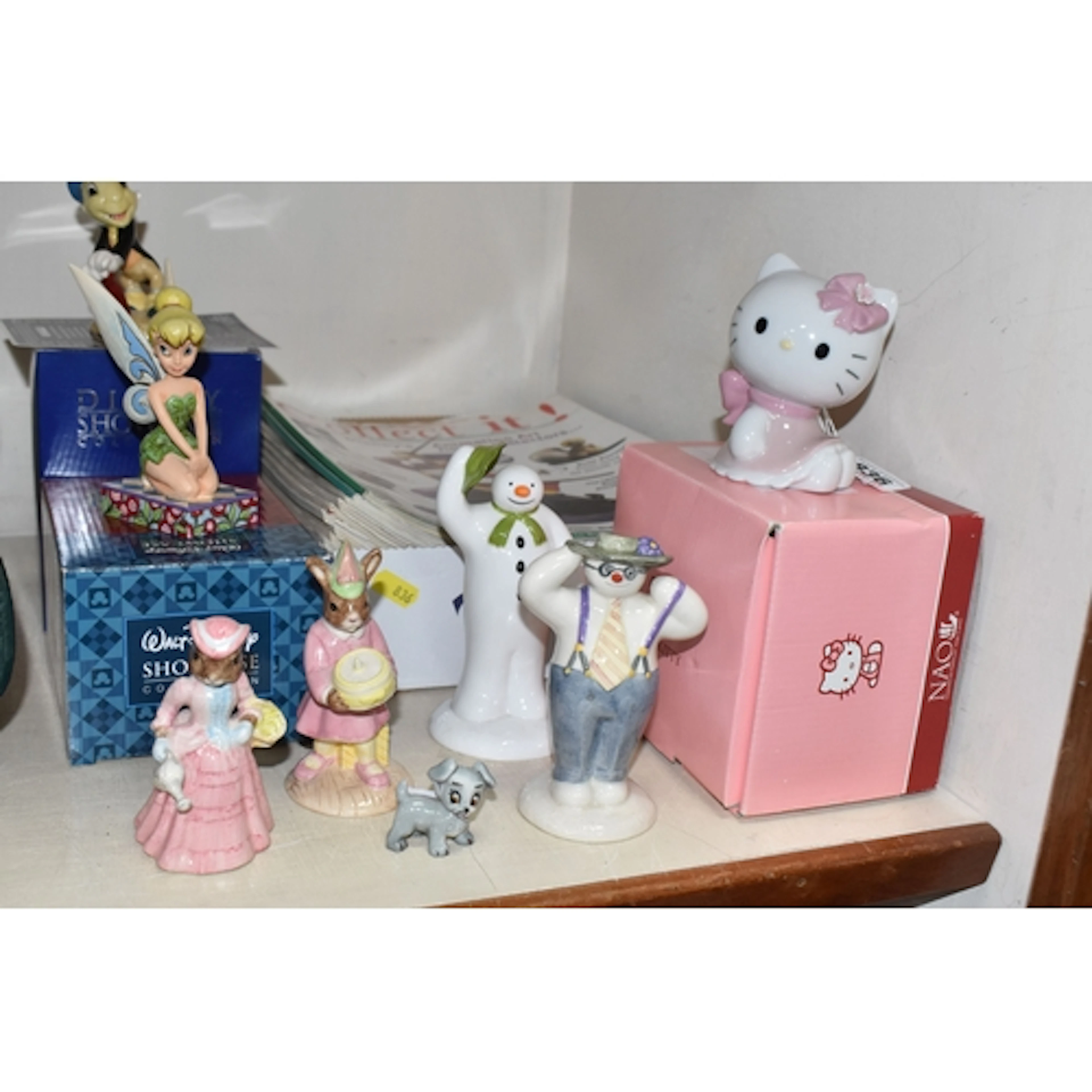 A GROUP OF FIGURES, comprising a boxed Nao Hello Kitty figur...