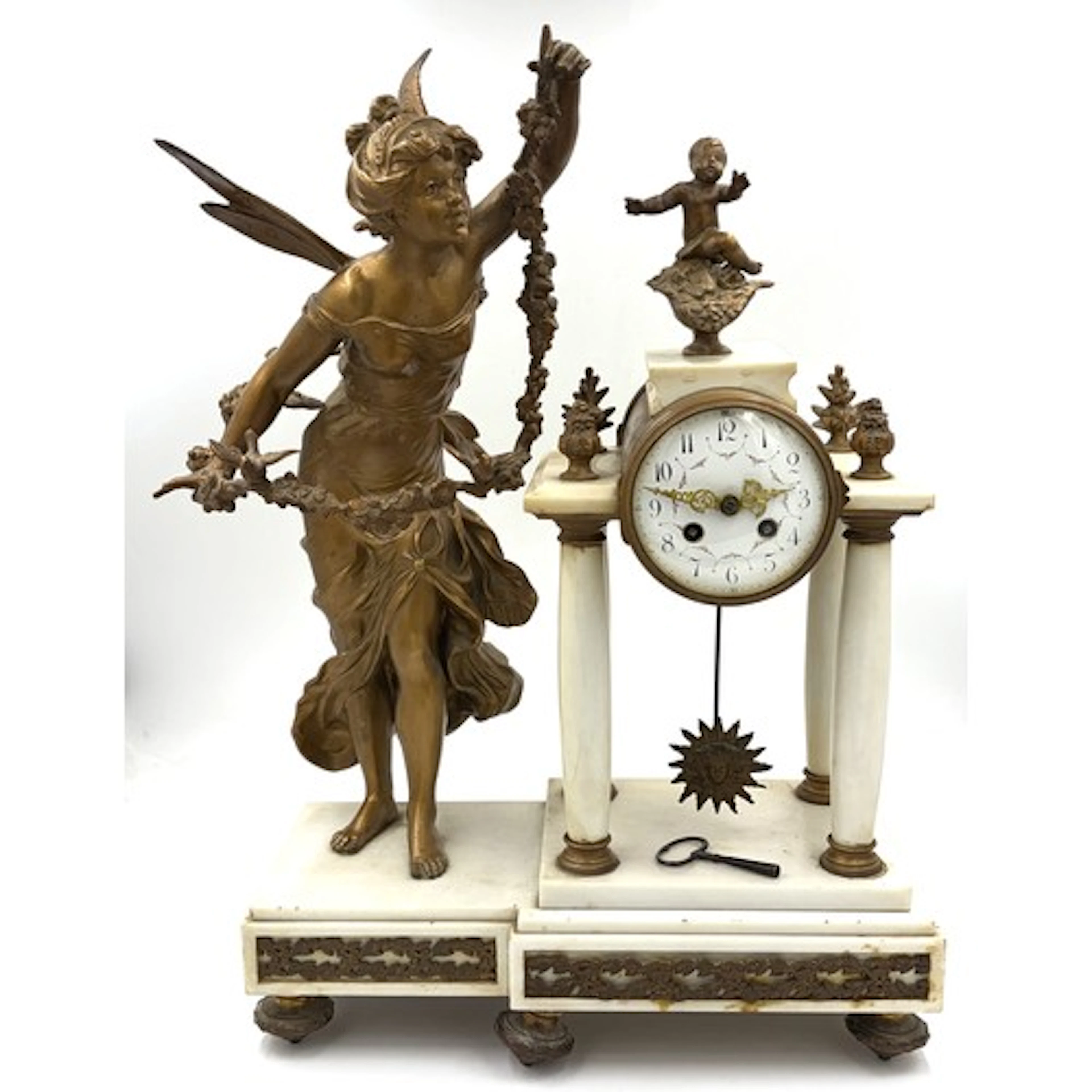 A 19thC French figural mantel clock featuring a Belle Epoque...