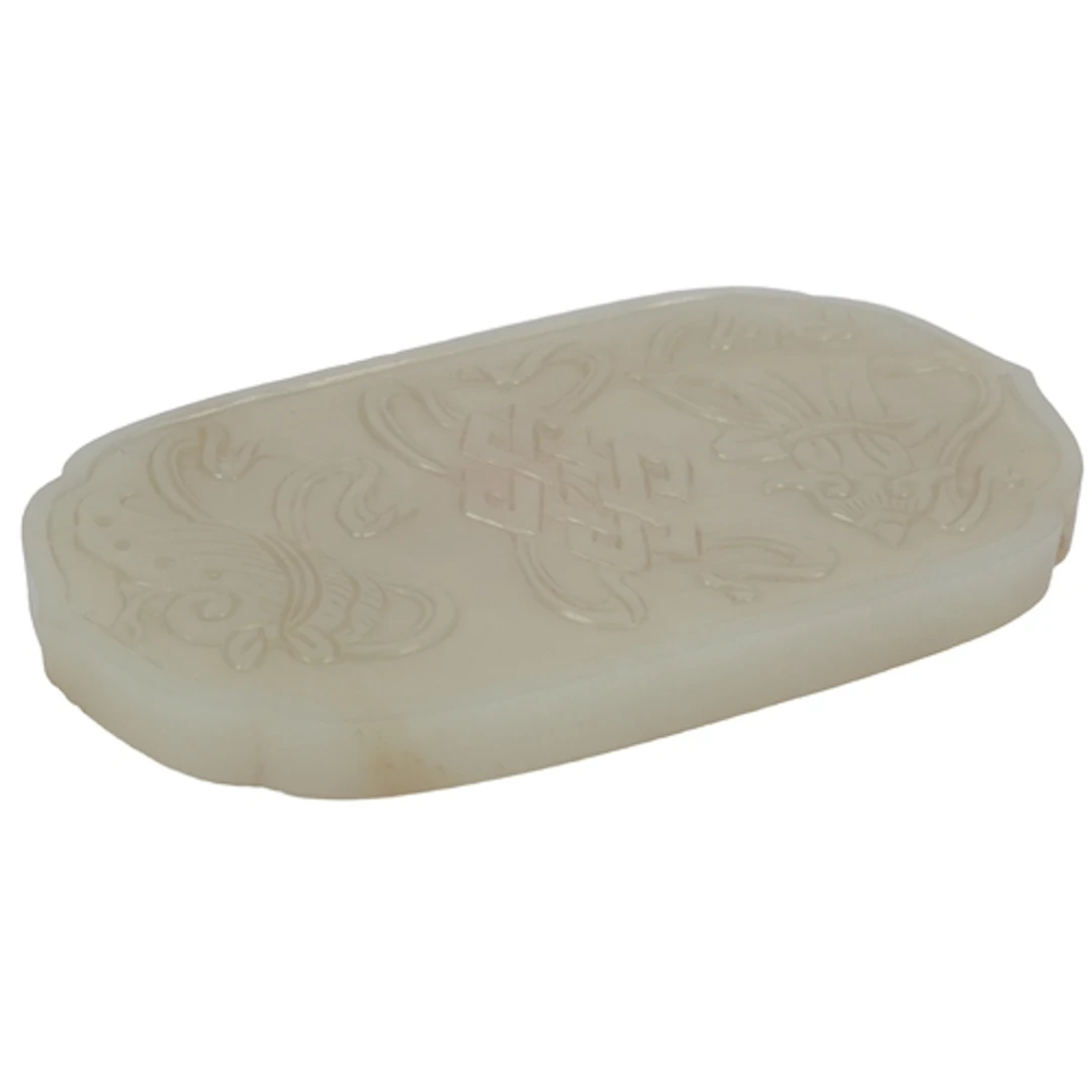 A Chinese pale celadon jade cover or plaque, 19th century, c...