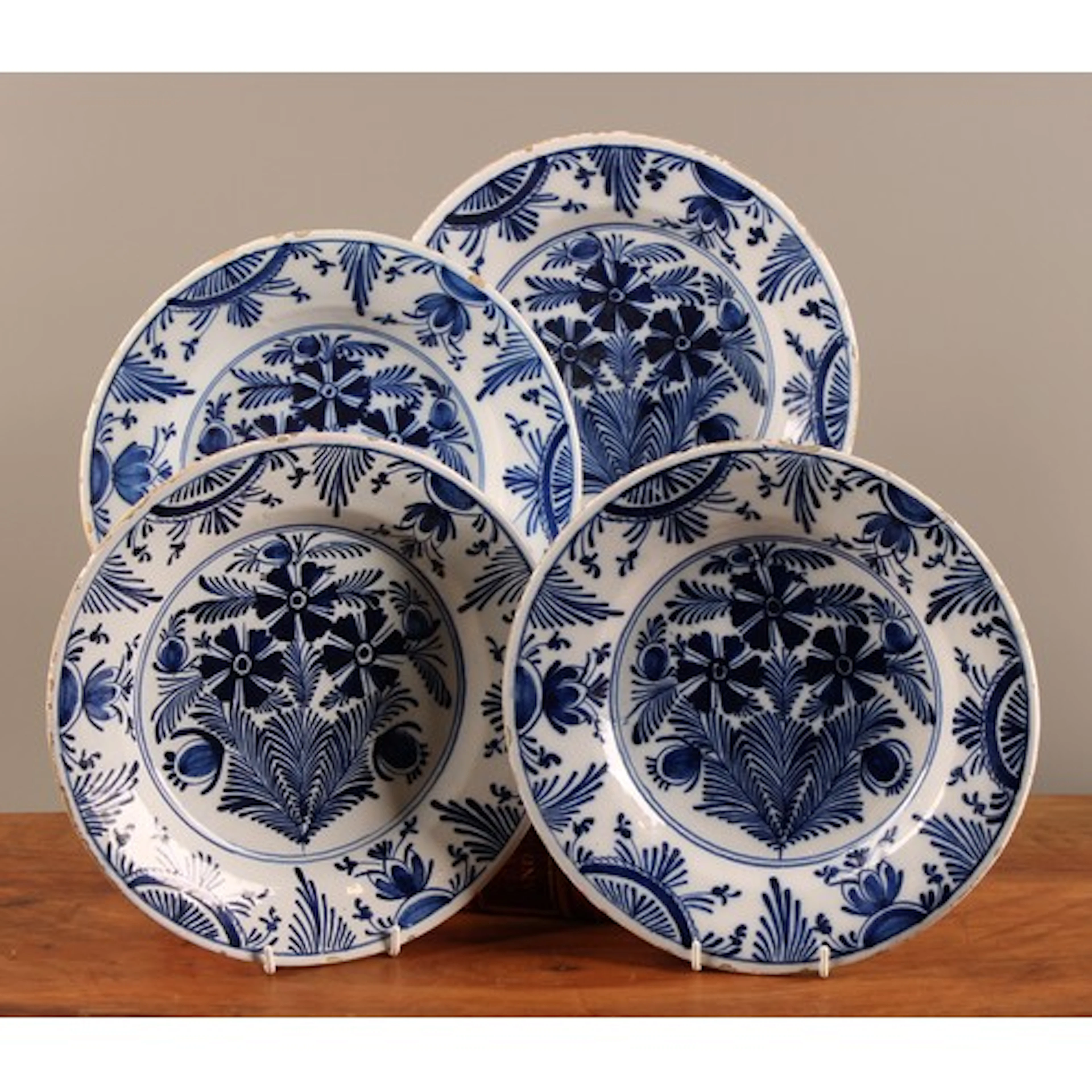 A set of four 18th century Dutch Delft plate, painted in ton...