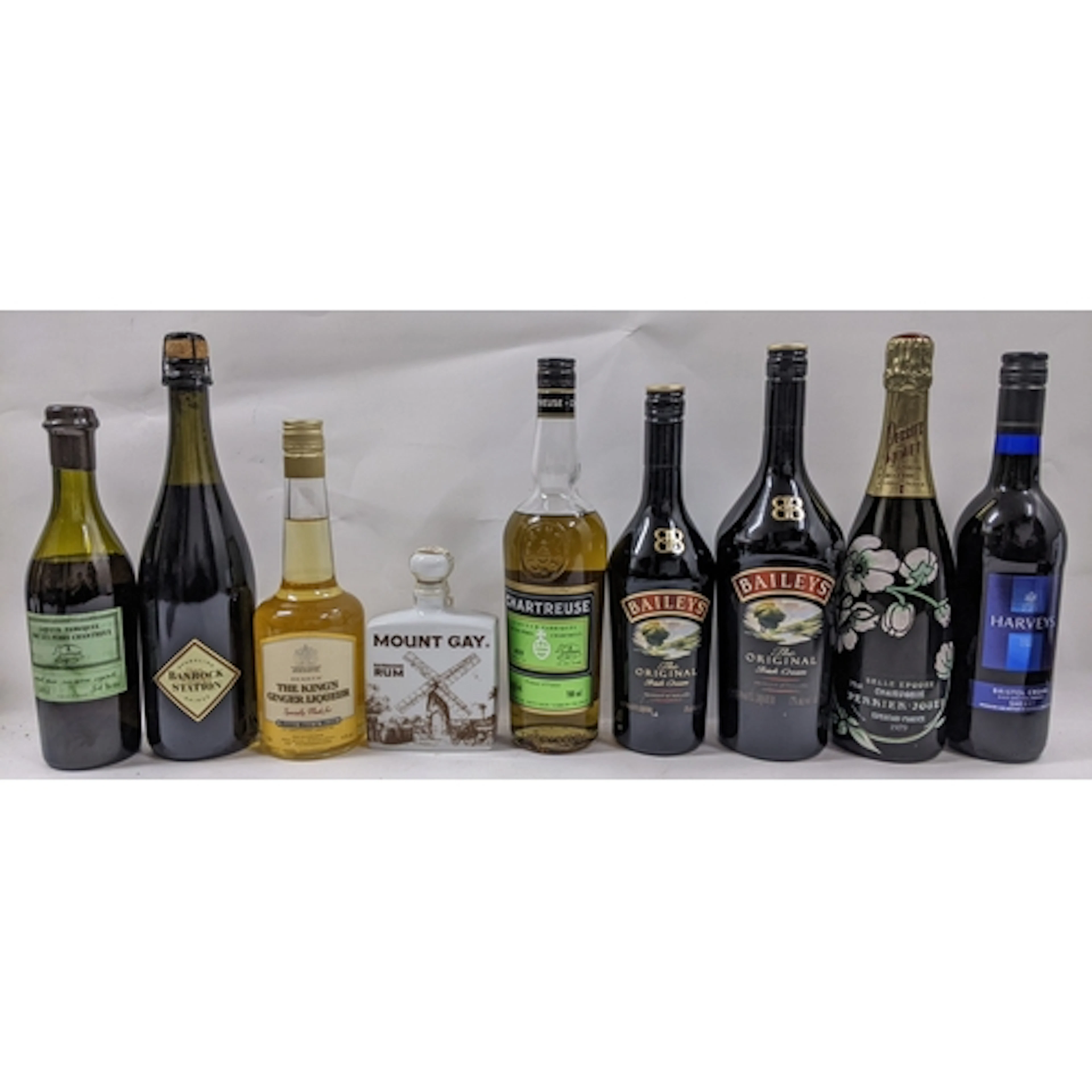 A mixed lot of nine bottles of spirits, liqueurs, and wine, ...