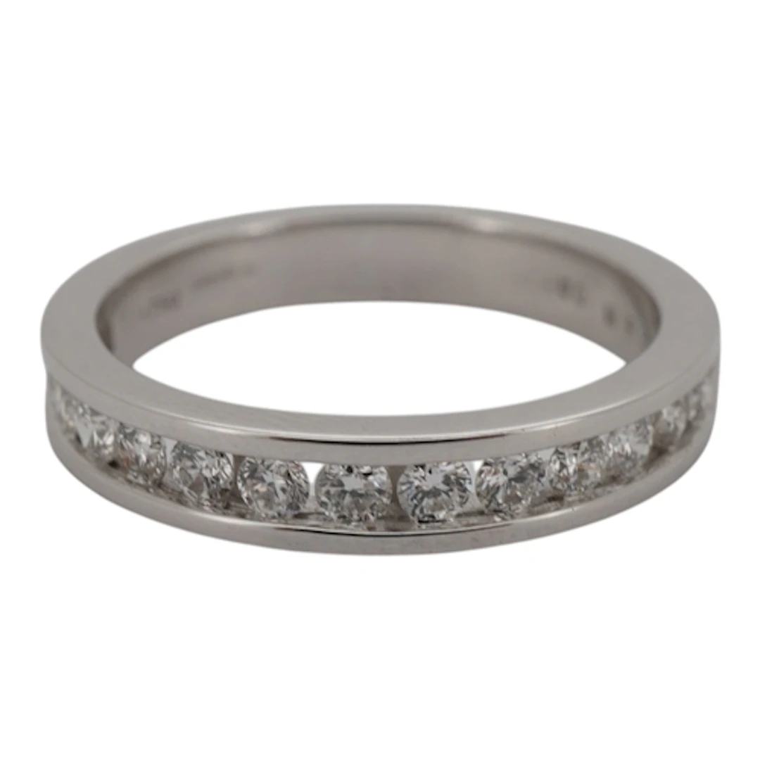 A diamond half eternity ring, channel-set to the front with ...