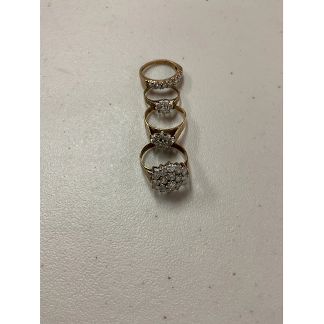 Four 9 ct CZ dress rings weight 12 grams.