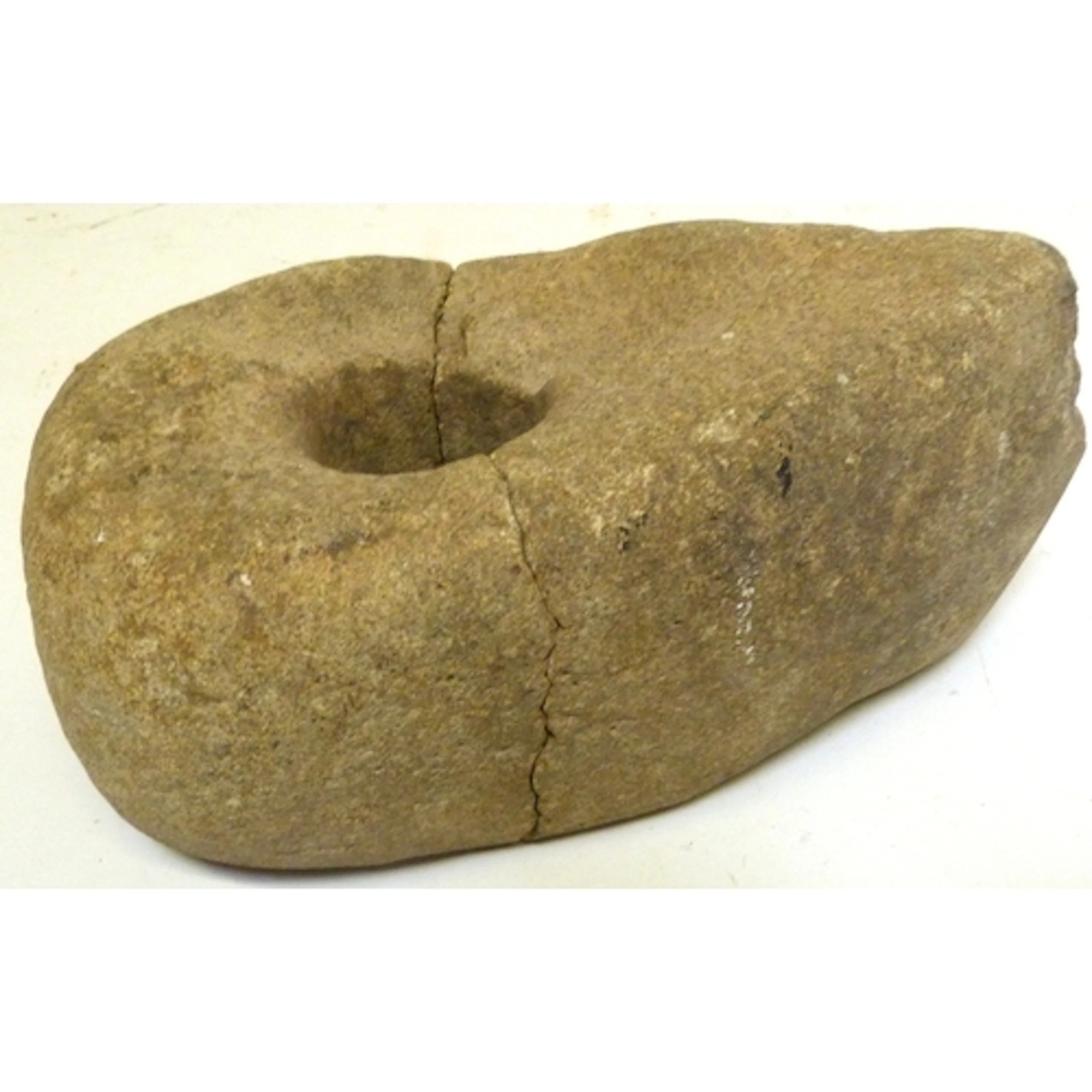 Ancient stone specimen fossil or artifact, likely used as a ...