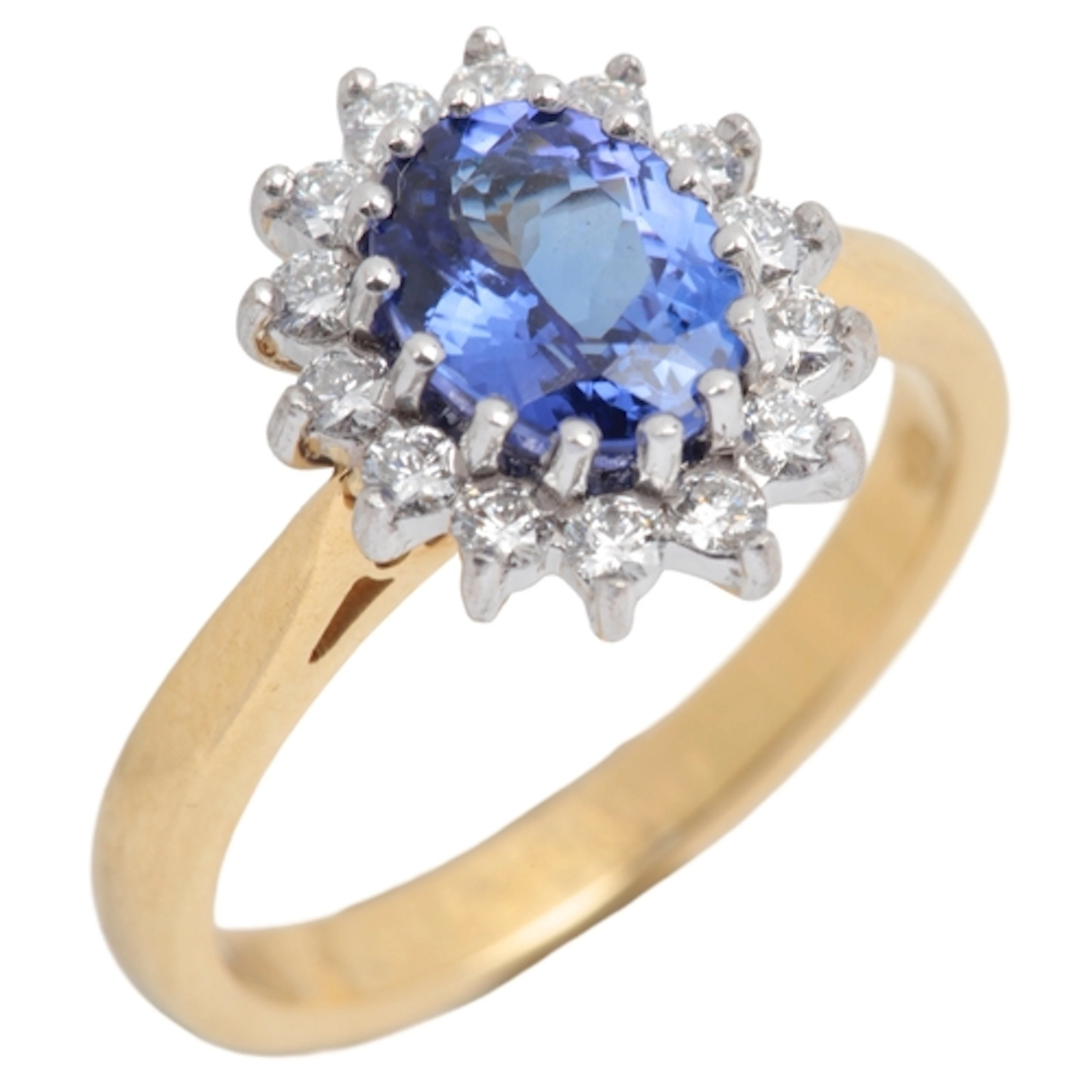 A tanzanite and diamond ring, of cluster design, set with an...