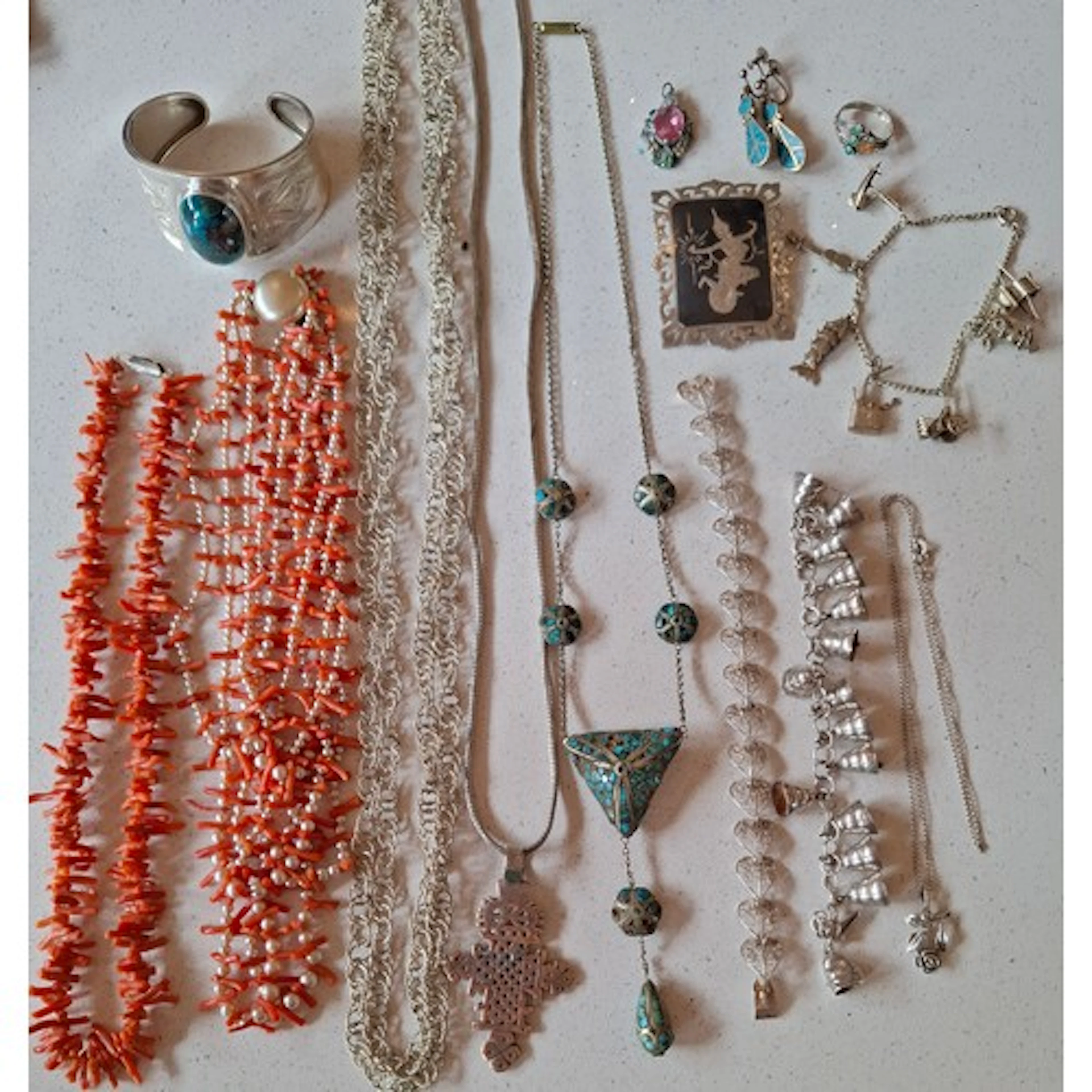 A quantity of silver, white metal, coral and turquoise jewel...