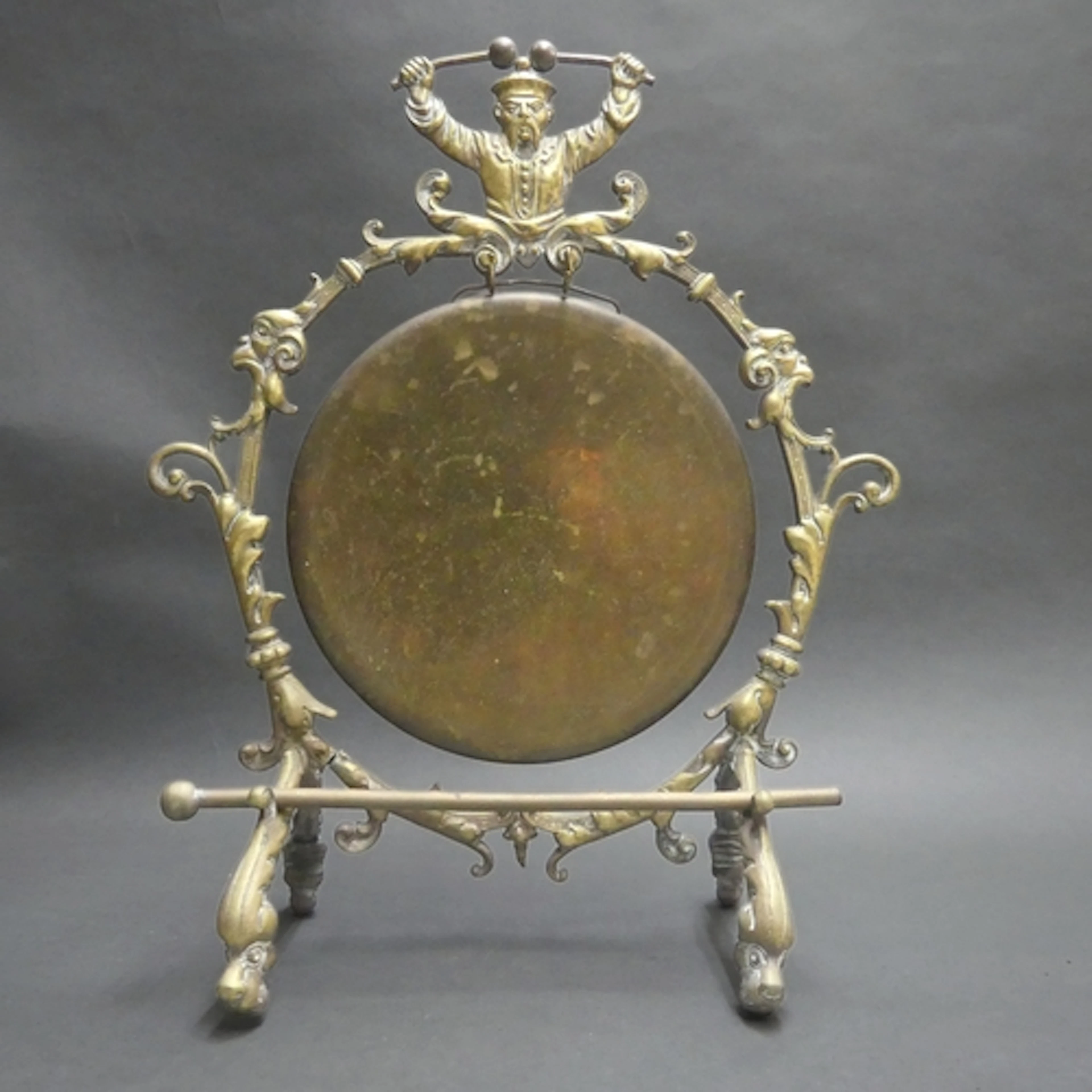 An Arts and Crafts period cast brass table gong, the rococo ...