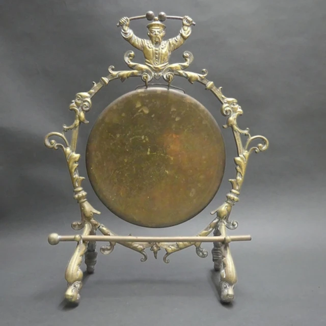 An Arts and Crafts period cast brass table gong, the rococo ...