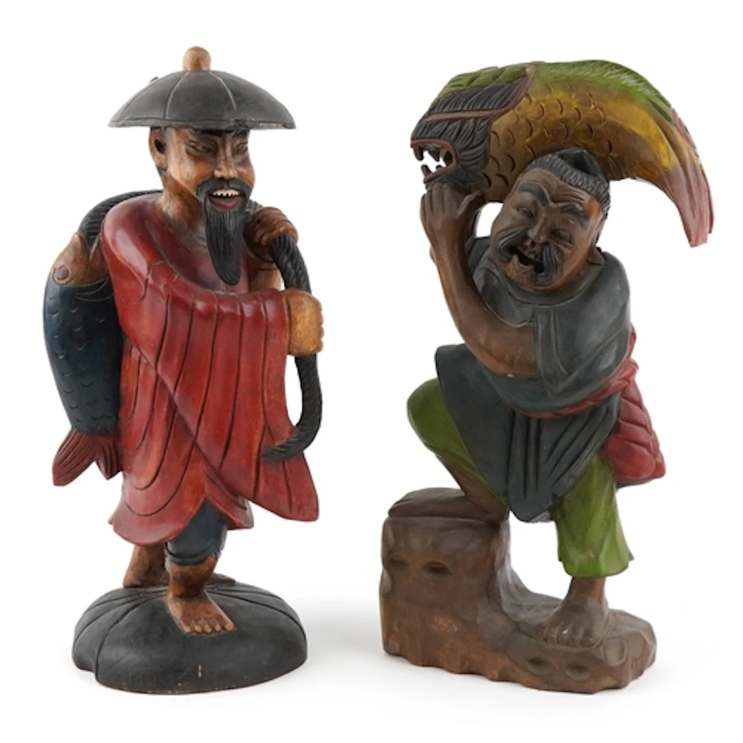 Two large hand carved wooden sculptures of Chinese fishermen...